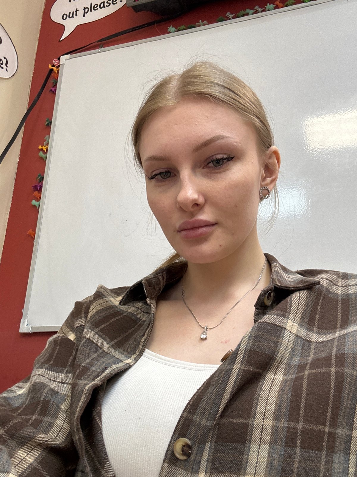 Woman takes multiple selfies, classroom scenes captured in Perm