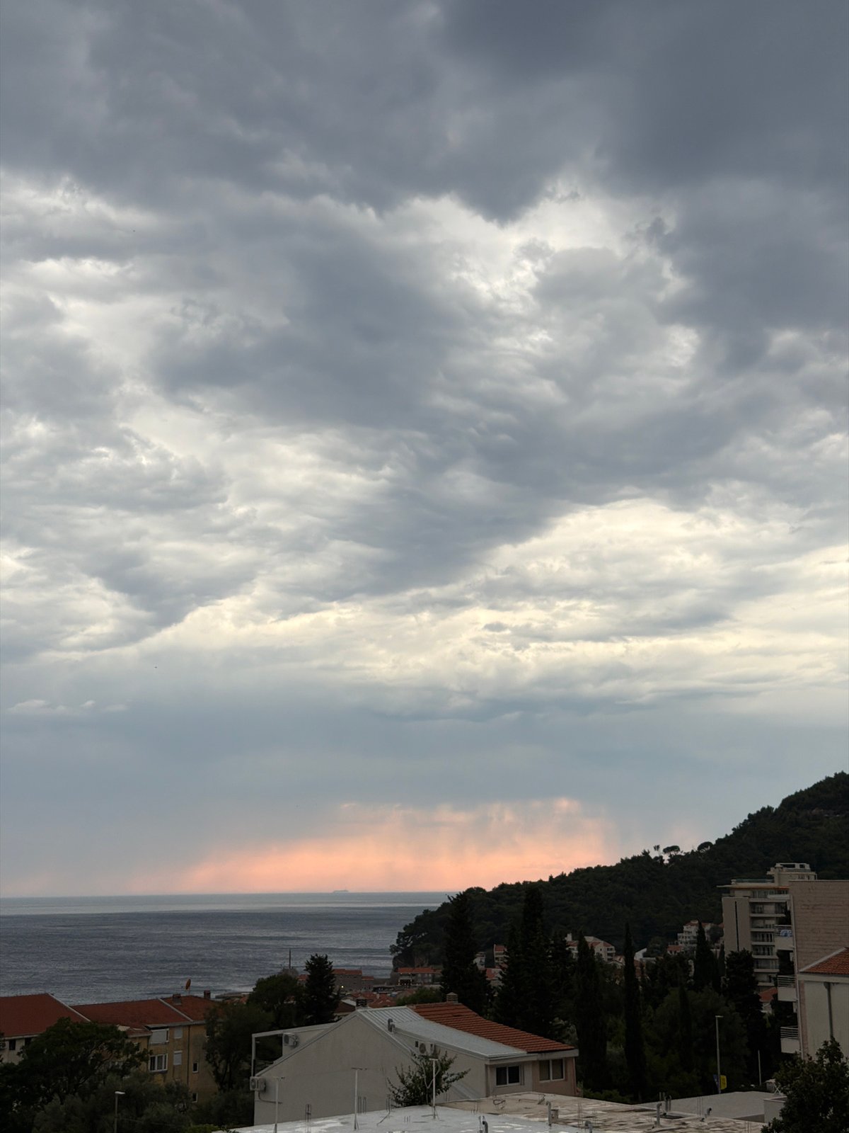 Storm clouds gather over Petrovac na Moru's Adriatic coastline