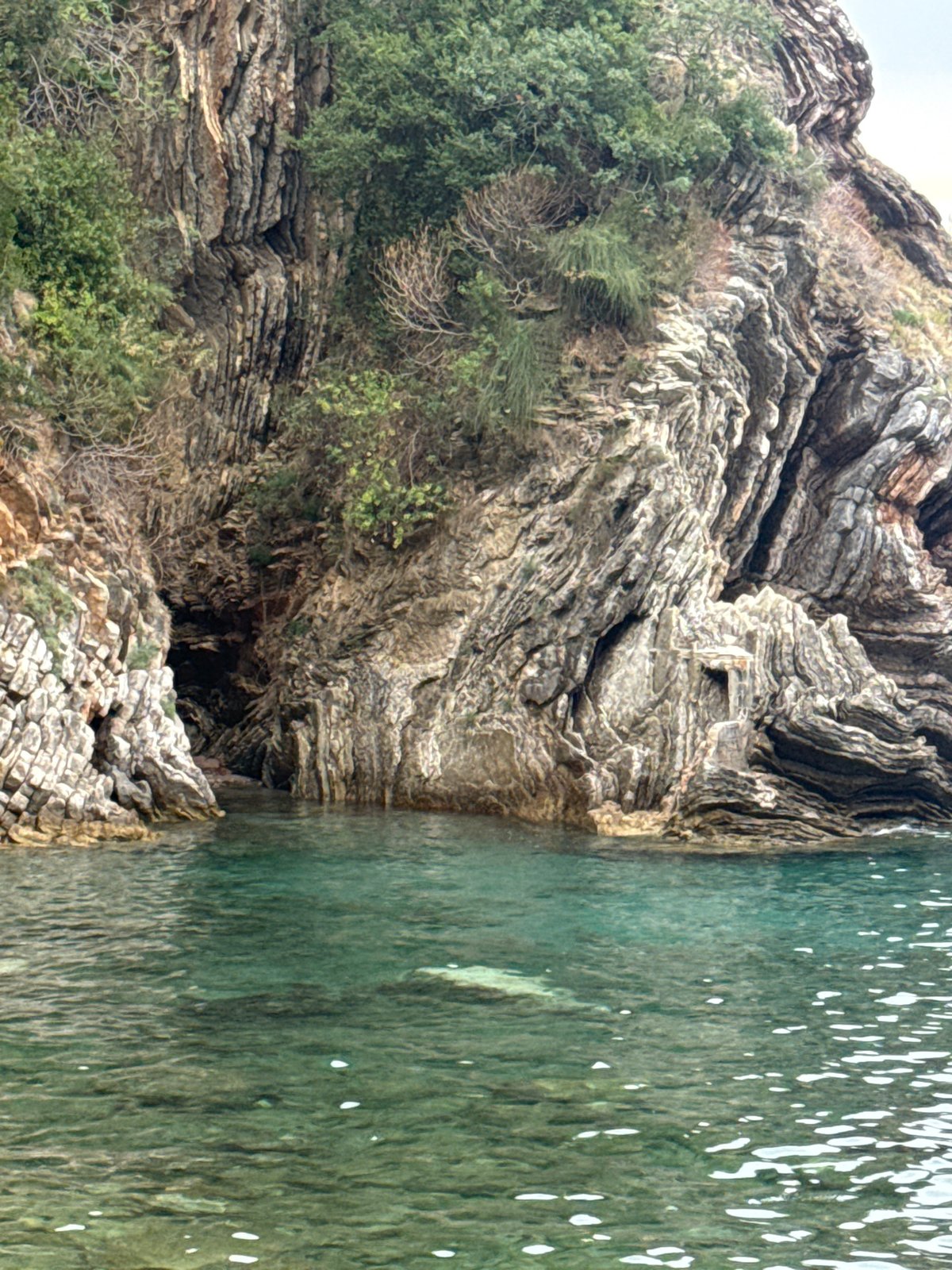 Rocky caves, clear coves, and coastline around Rafailovići, Montenegro