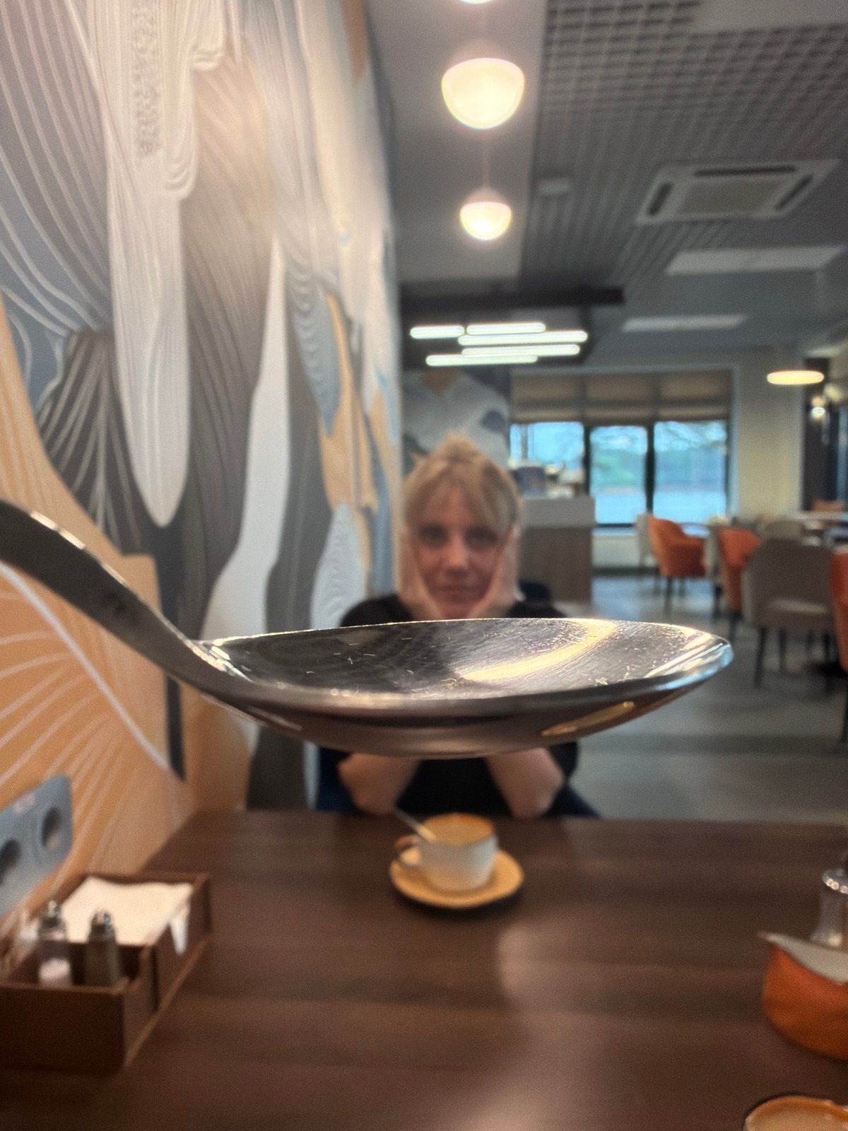 Reflective metal spoon photographed in distorted perspective, Chaikovsky Russia