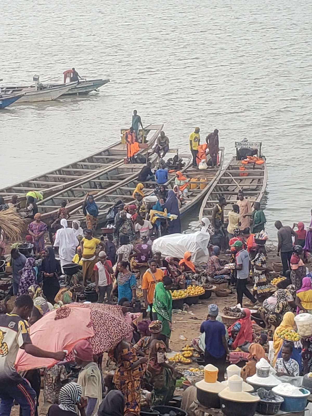 Busy riverside markets and boat transport documented in Lokoja