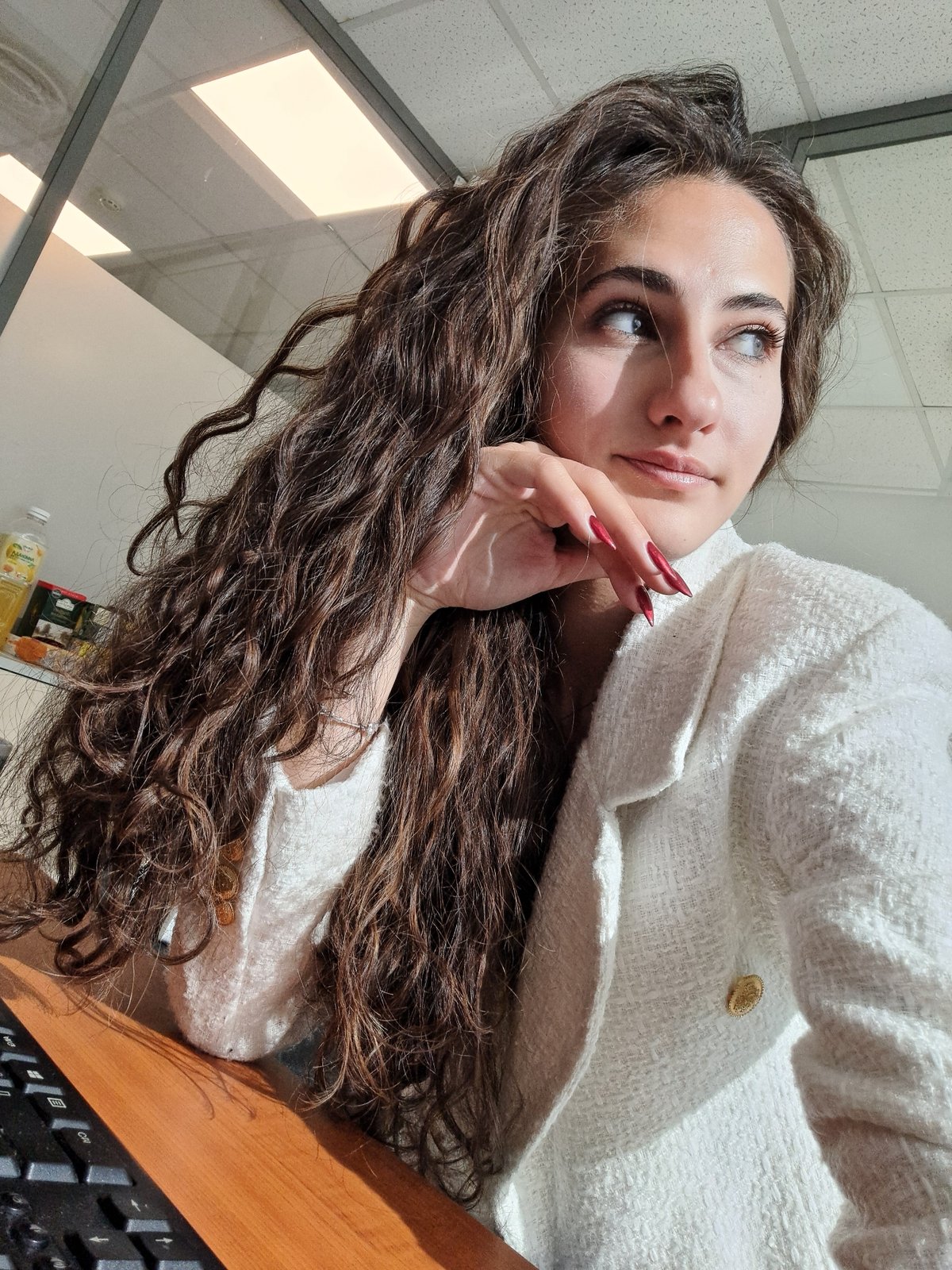 Morning photo session captures woman in white jacket, Sofia