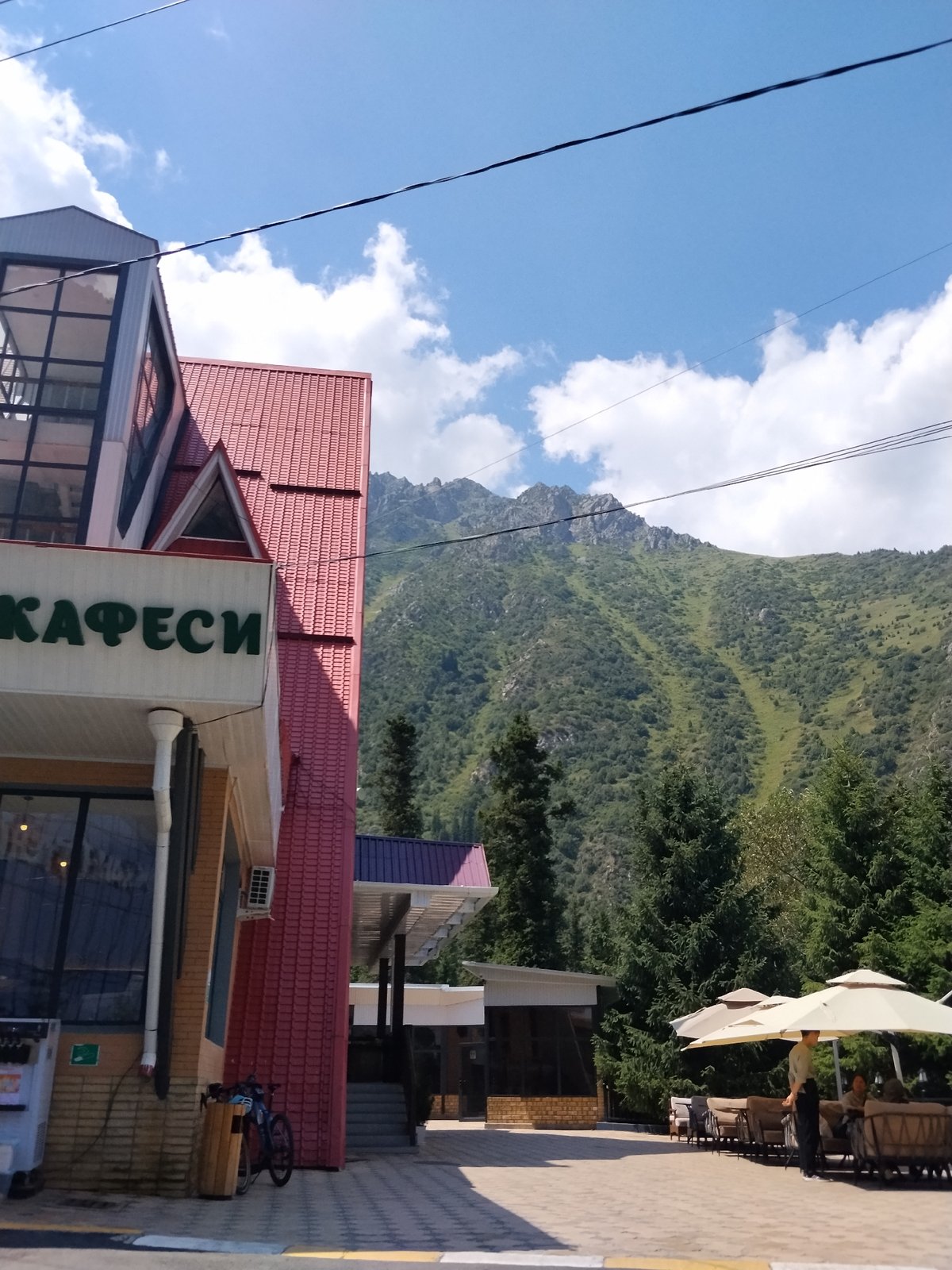 Mountain leisure spot in Kyrgyzstan, busy on a summer morning