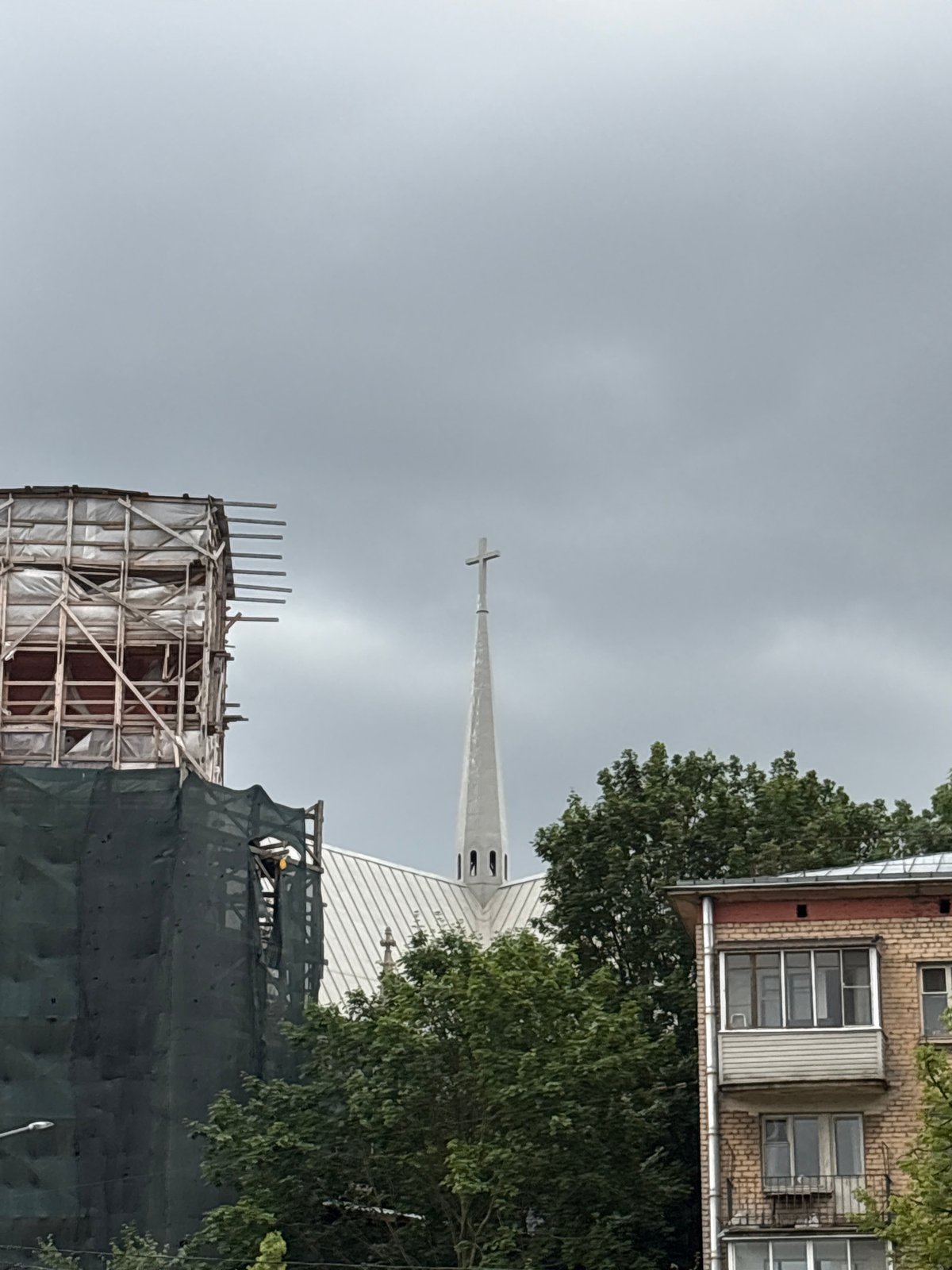 Church spires, renovation sites, and a duck pond in Saint Petersburg