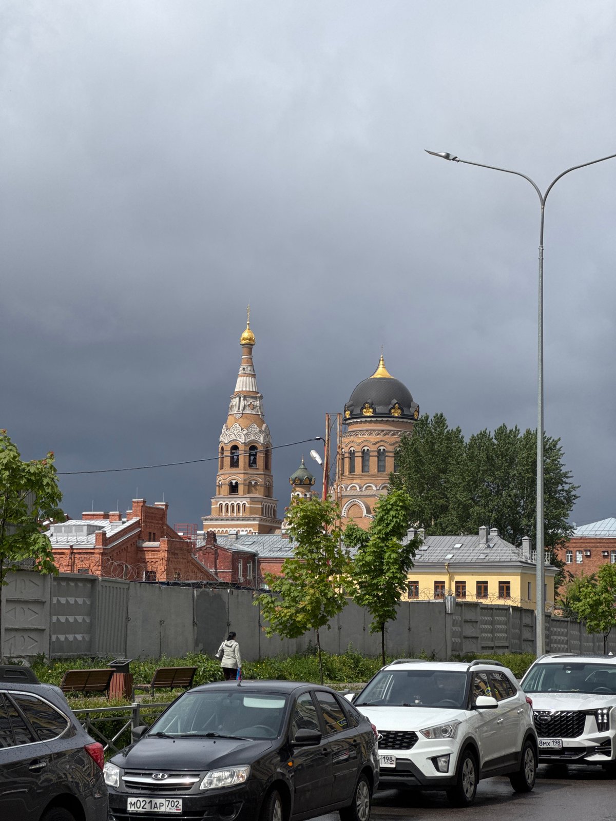 Saint Petersburg's golden church spires photographed under overcast skies