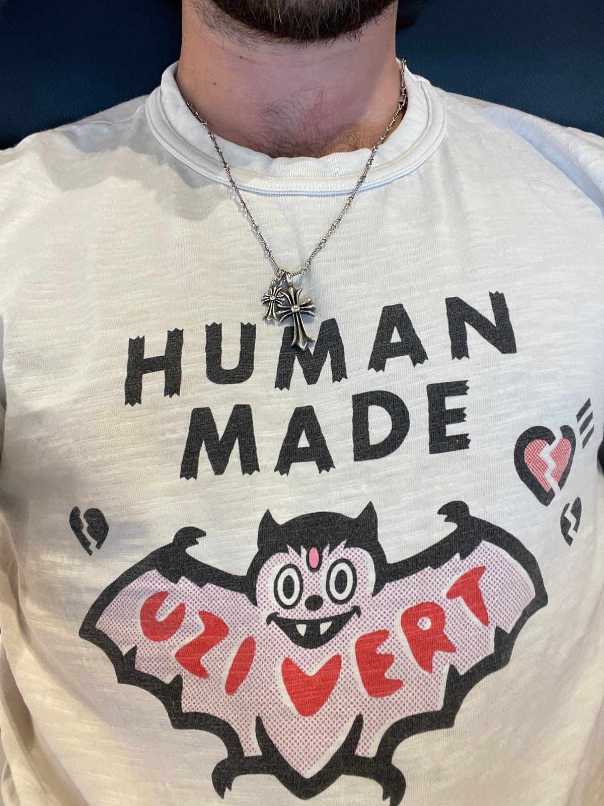 Person in graphic t-shirt spotted resting on couch in Mexico City