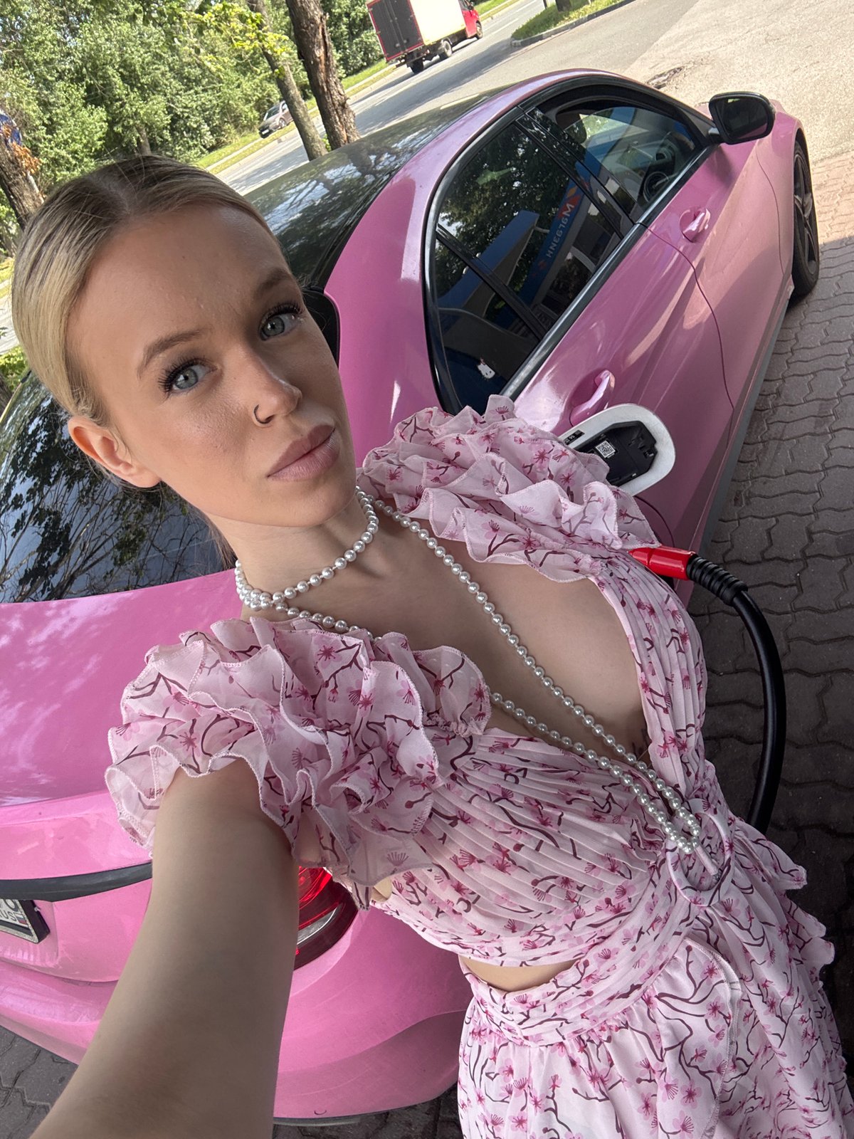 Pit stop at a Saint Petersburg EV charger, pink car in frame