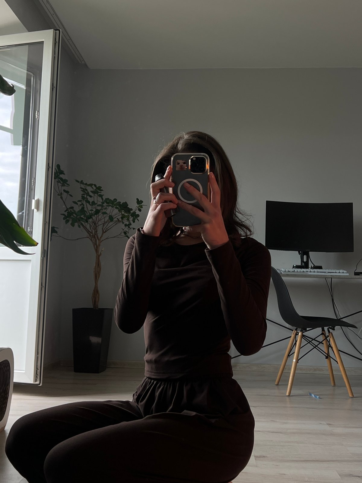 Mirror selfie session in a Ternopil apartment, brown outfit