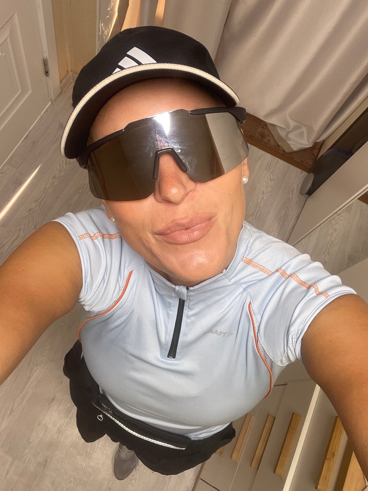 Person takes mirror selfies in athletic wear in Baranovka