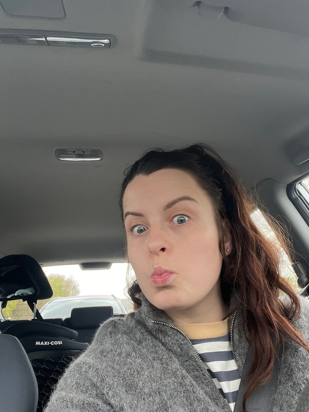 Woman takes selfie in vehicle in Meisenheim