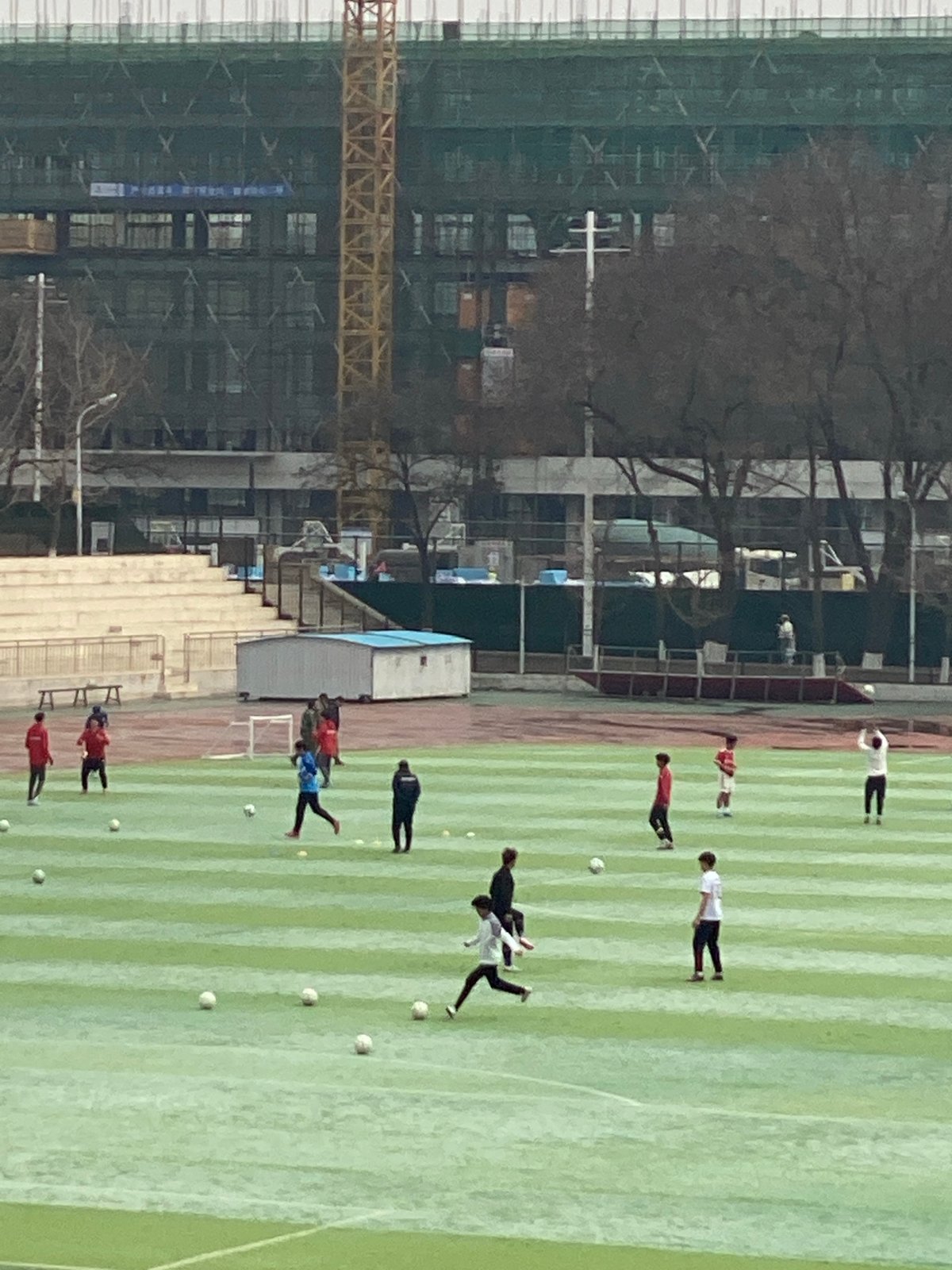 Soccer training session near construction site in Zhongtun