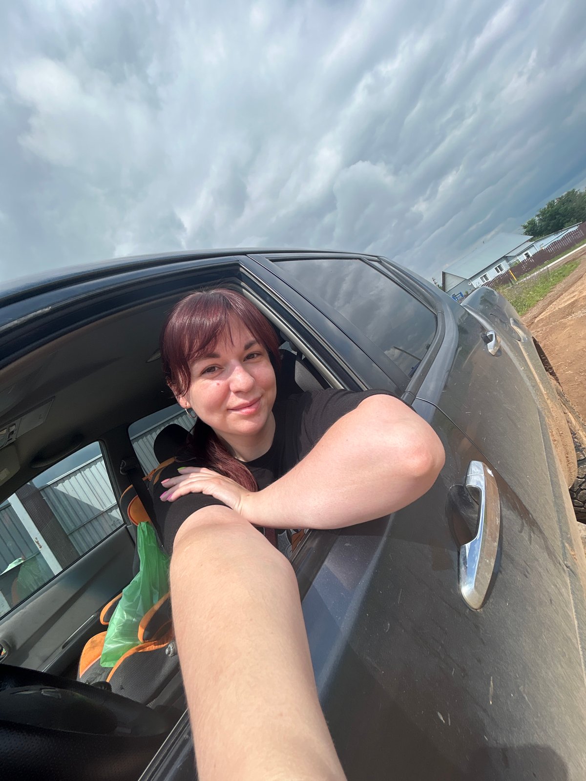 Summer car hangout on a dirt road in rural Russia