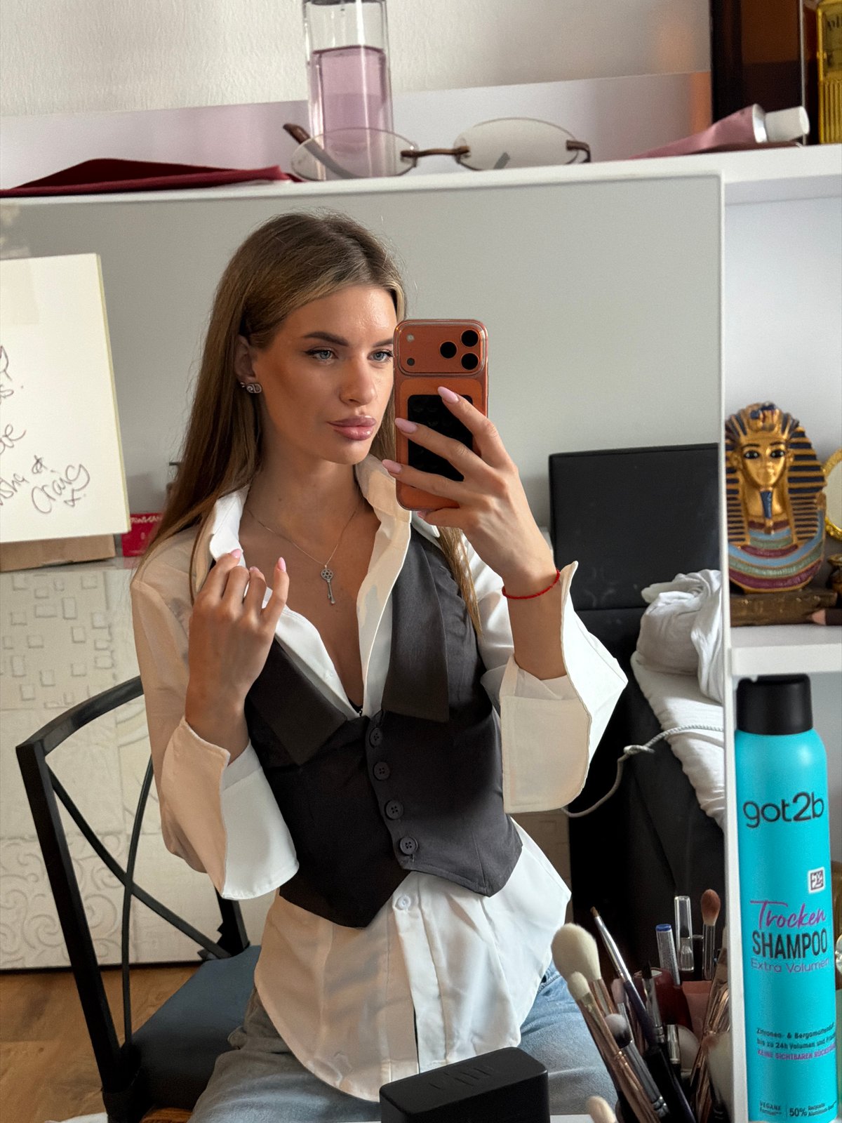 Woman Takes Mirror Selfie in Berlin Bathroom