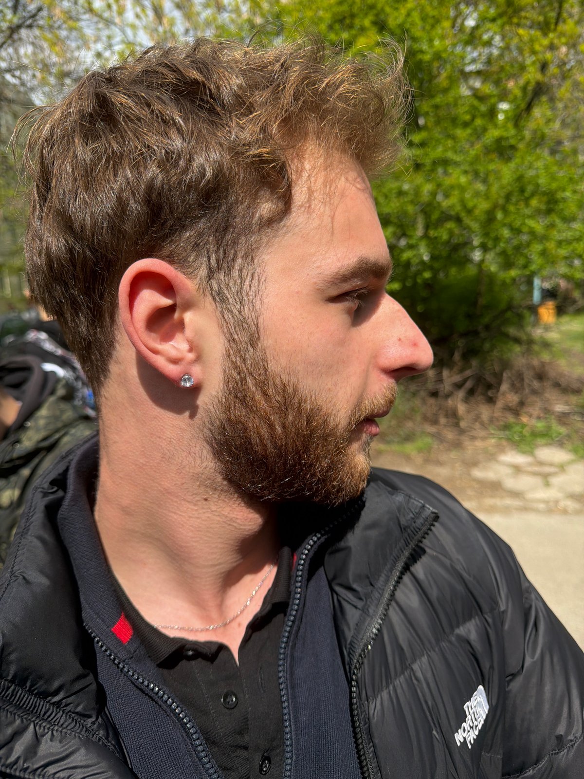 Young man photographed in profile outdoors in Sofia