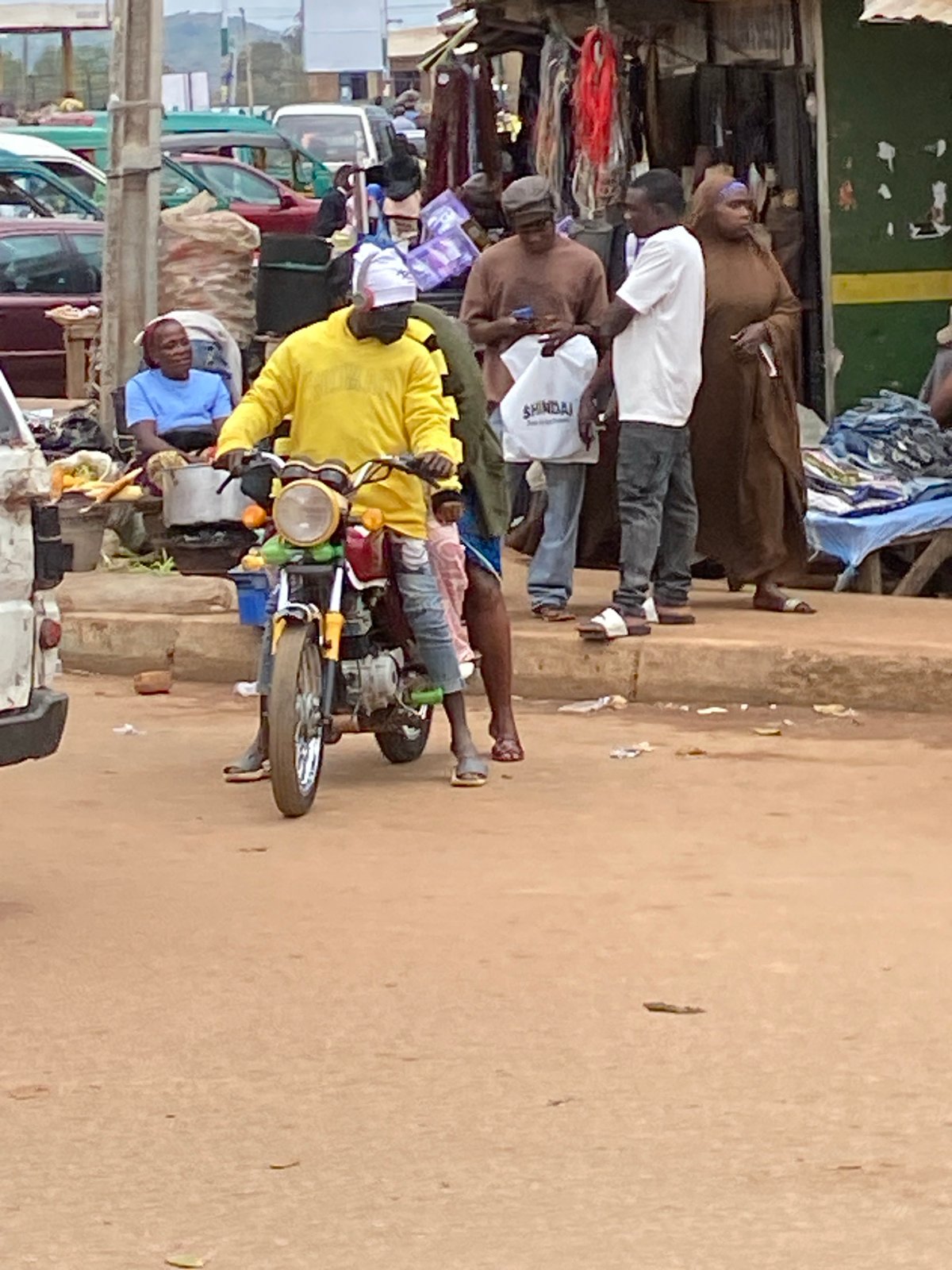 Bukuru market street buzzing with vendors and traffic