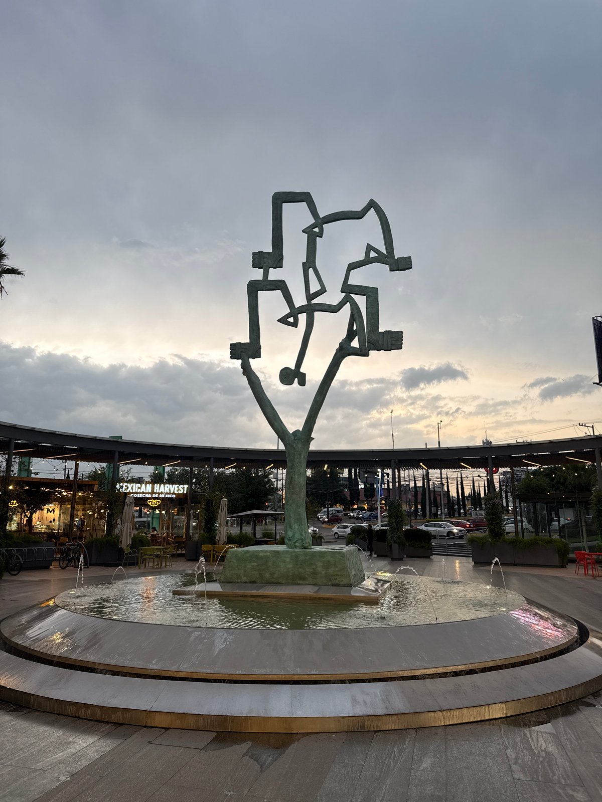 Modern sculpture and fountain observed in Puebla public space