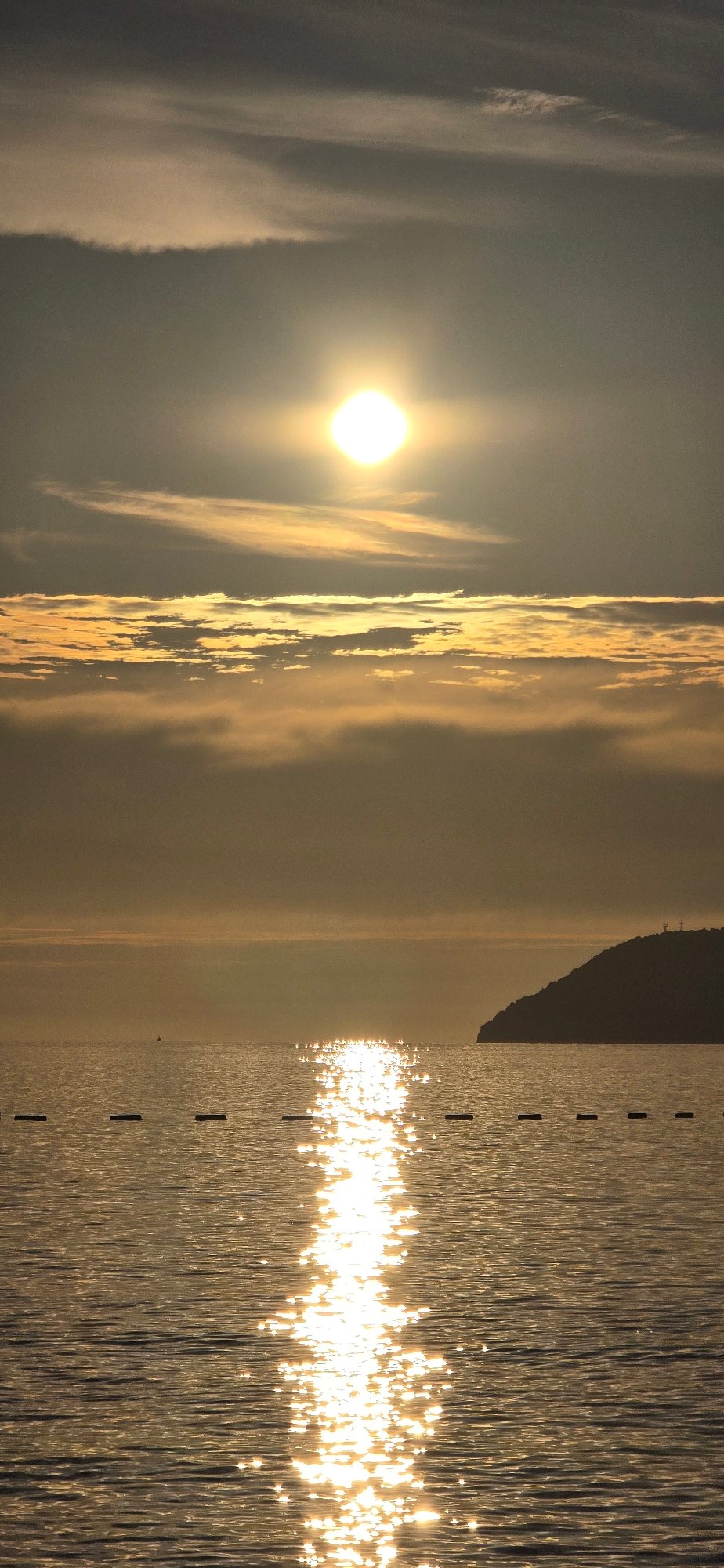 Fishing boat, sailing catamaran spotted during sunset in Bar, Montenegro