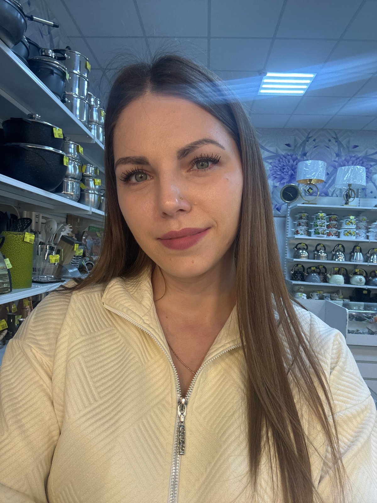 Woman documents shopping trip with selfies in Klin store