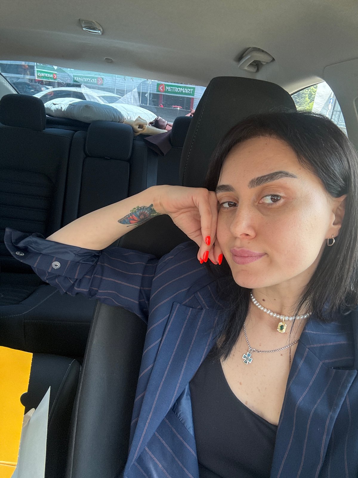 Woman takes car selfies in Tbilisi during morning hours