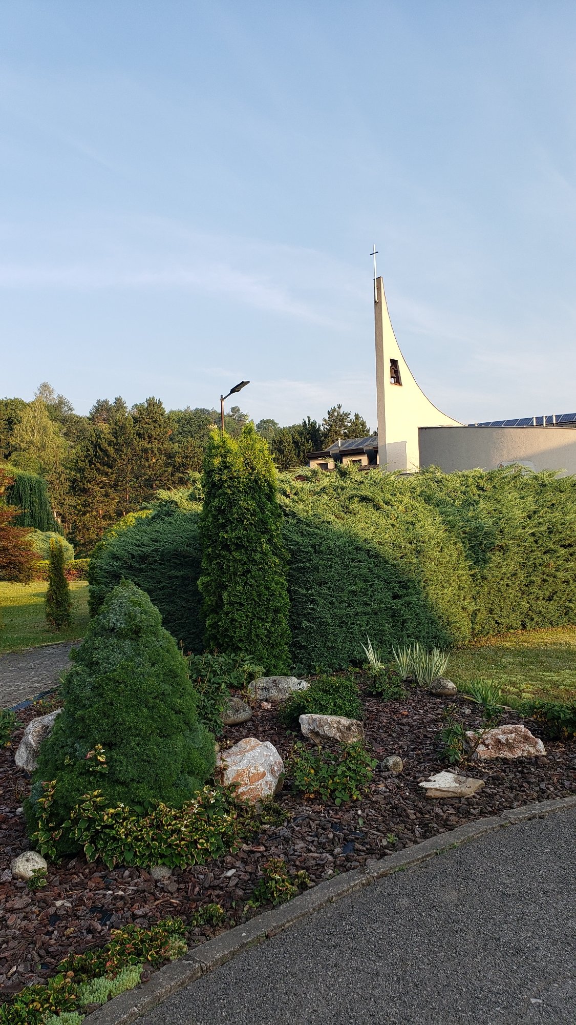 Sunny stroll through a church park in Prešov, Slovakia
