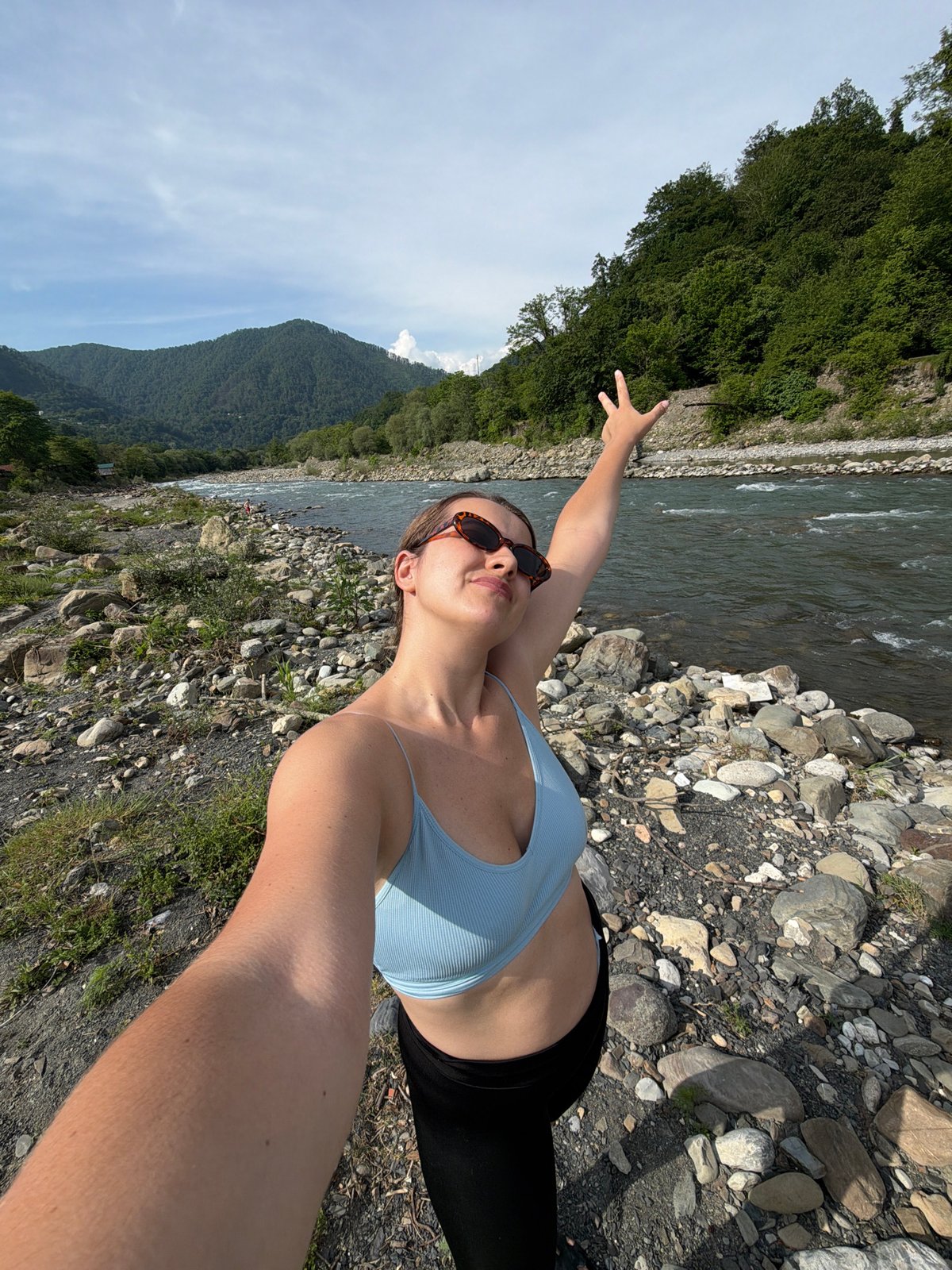 Family camping trip documented along scenic river near Sochi