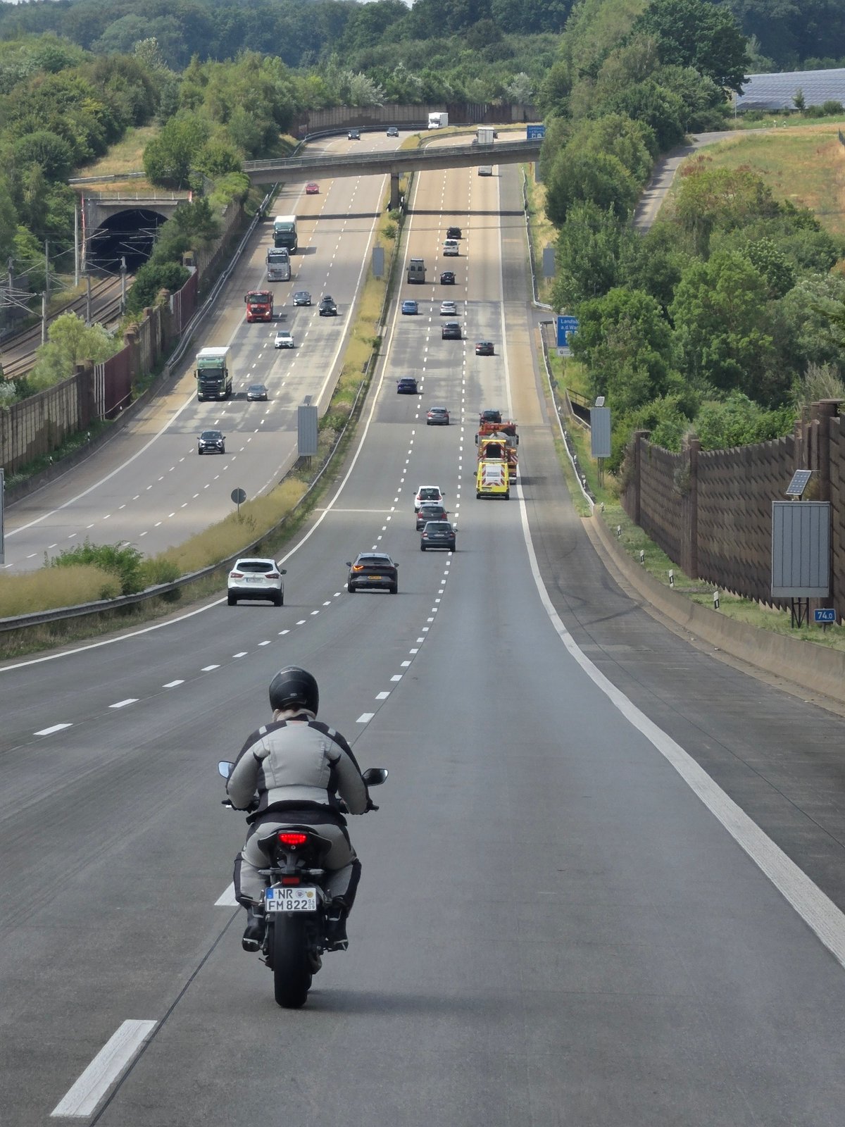 Motorcycle cruising a multi-lane highway in Oberhaid, Germany
