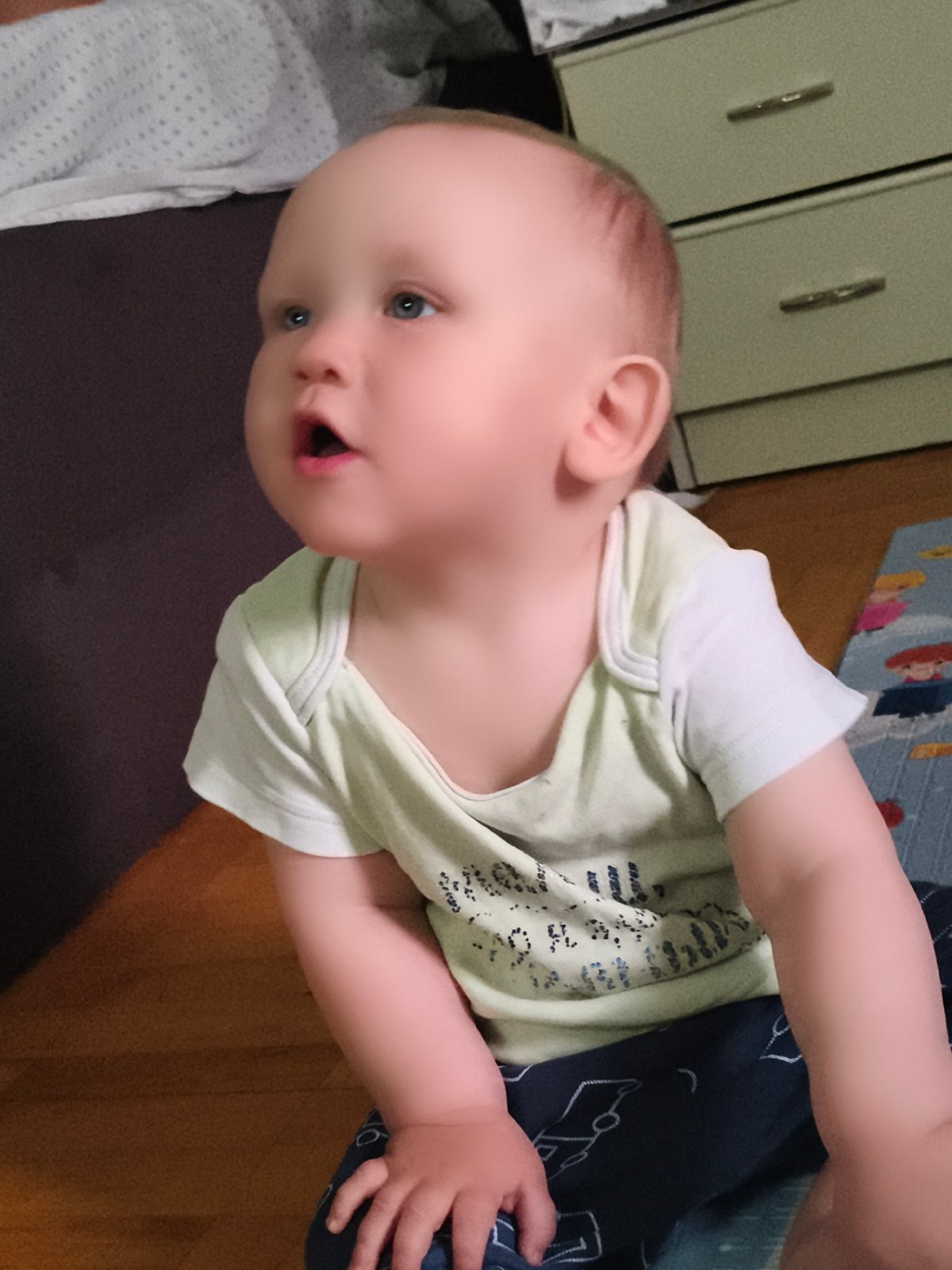 Baby and dachshund share a quiet evening at home in Chaikovsky