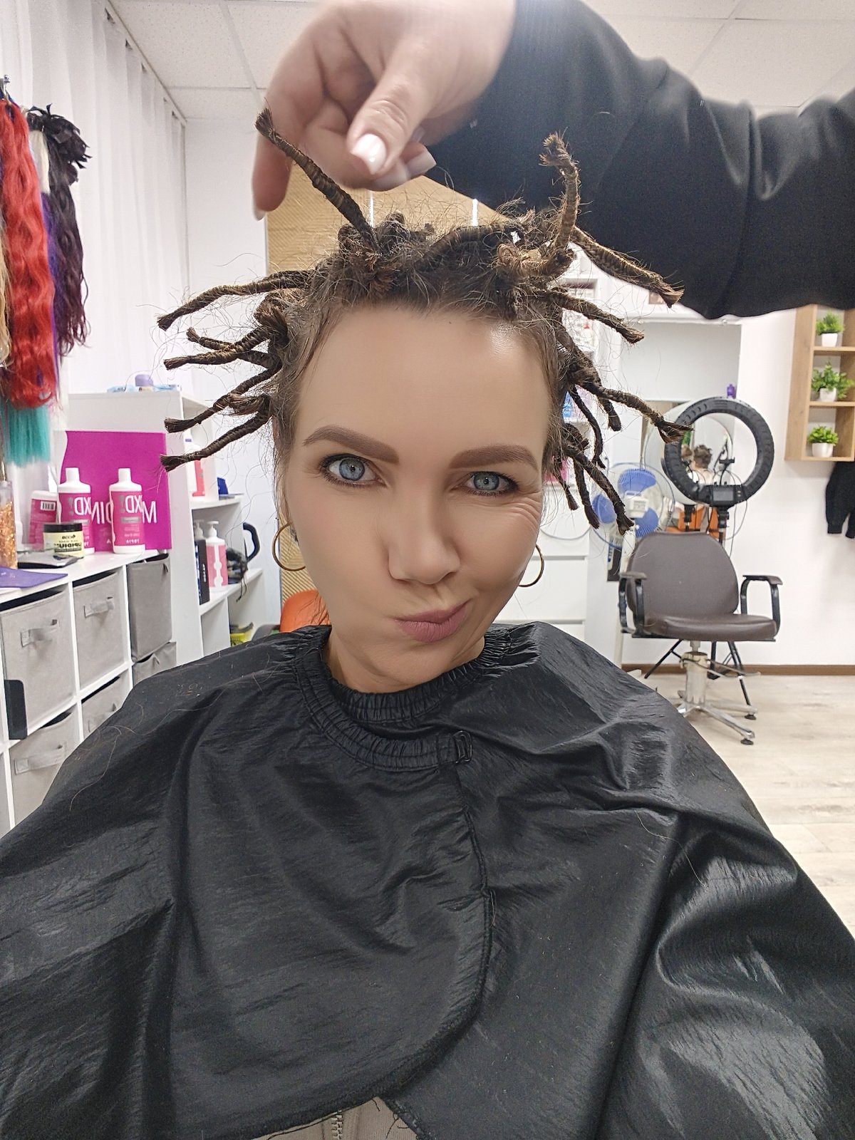 Woman documents hair salon appointment through selfies and photos