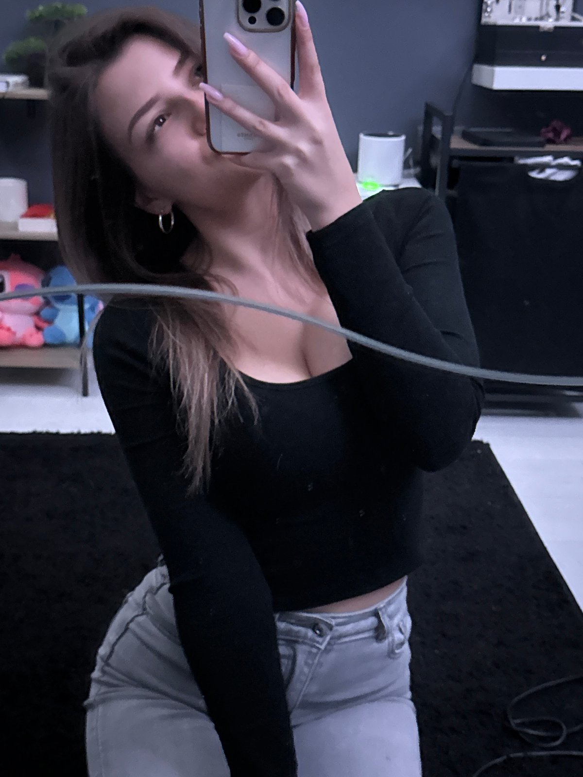 Woman takes selfies in Sofia apartment room