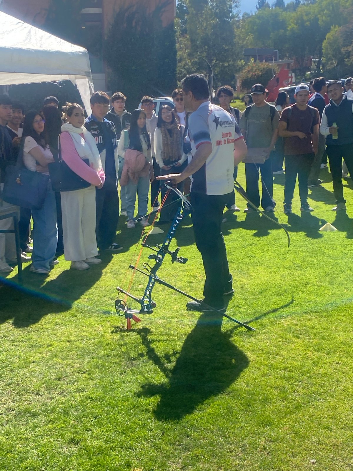 Archery instructor teaches young people bow techniques in Bolivia