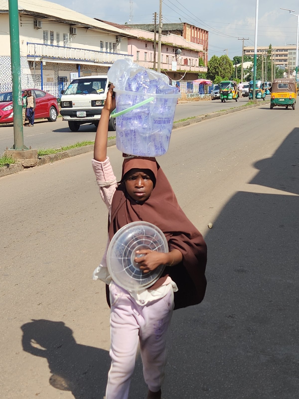 Street life and vendors on a busy Jos afternoon