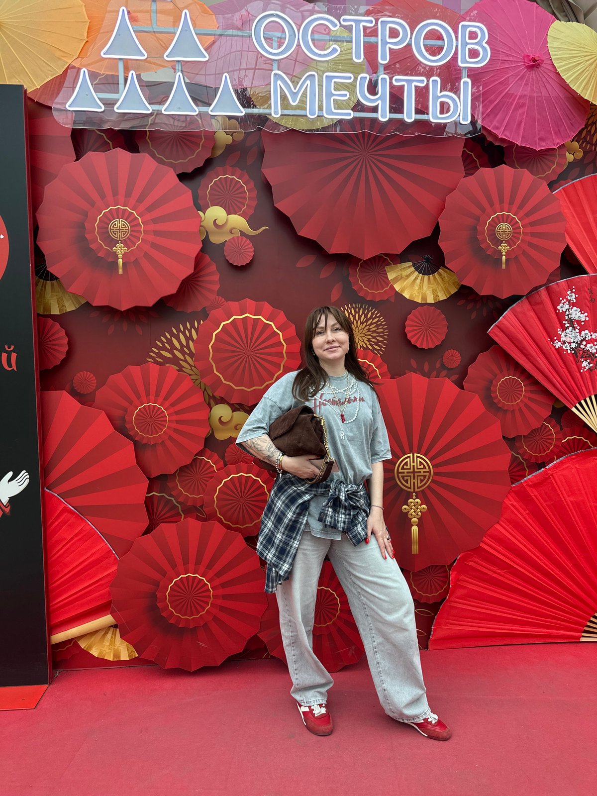 Woman visits Chinese restaurant, Dream Island amusement park in Moscow