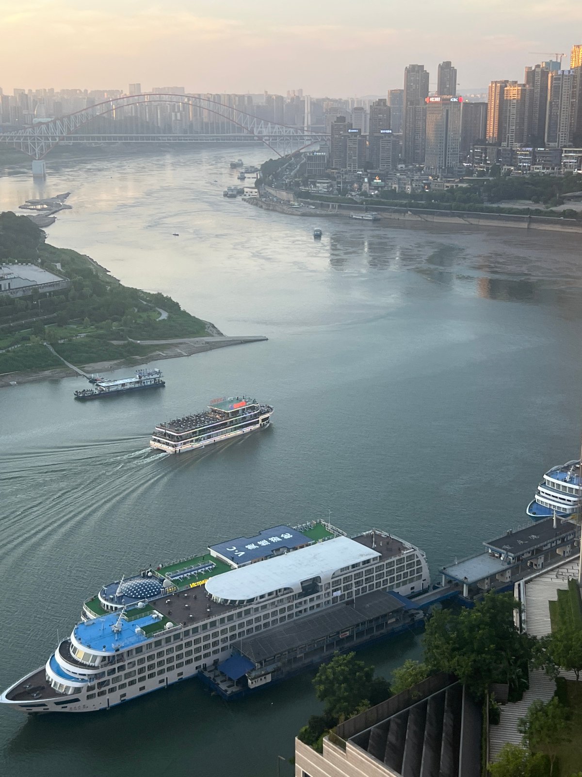 Yangtze River flows past Chongqing's urban core, ships docked