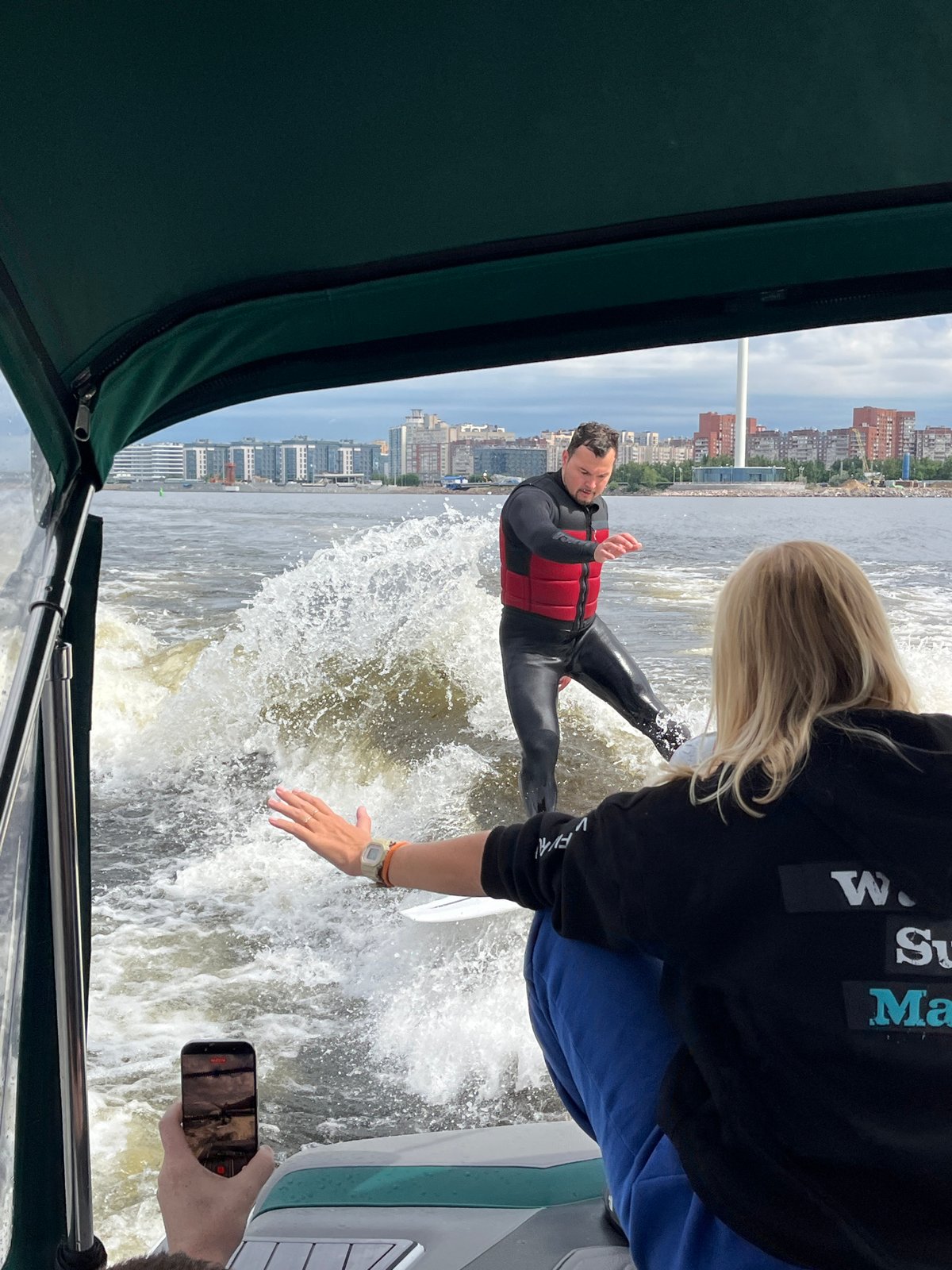 Wakeboarding on the river with Saint Petersburg's skyline behind