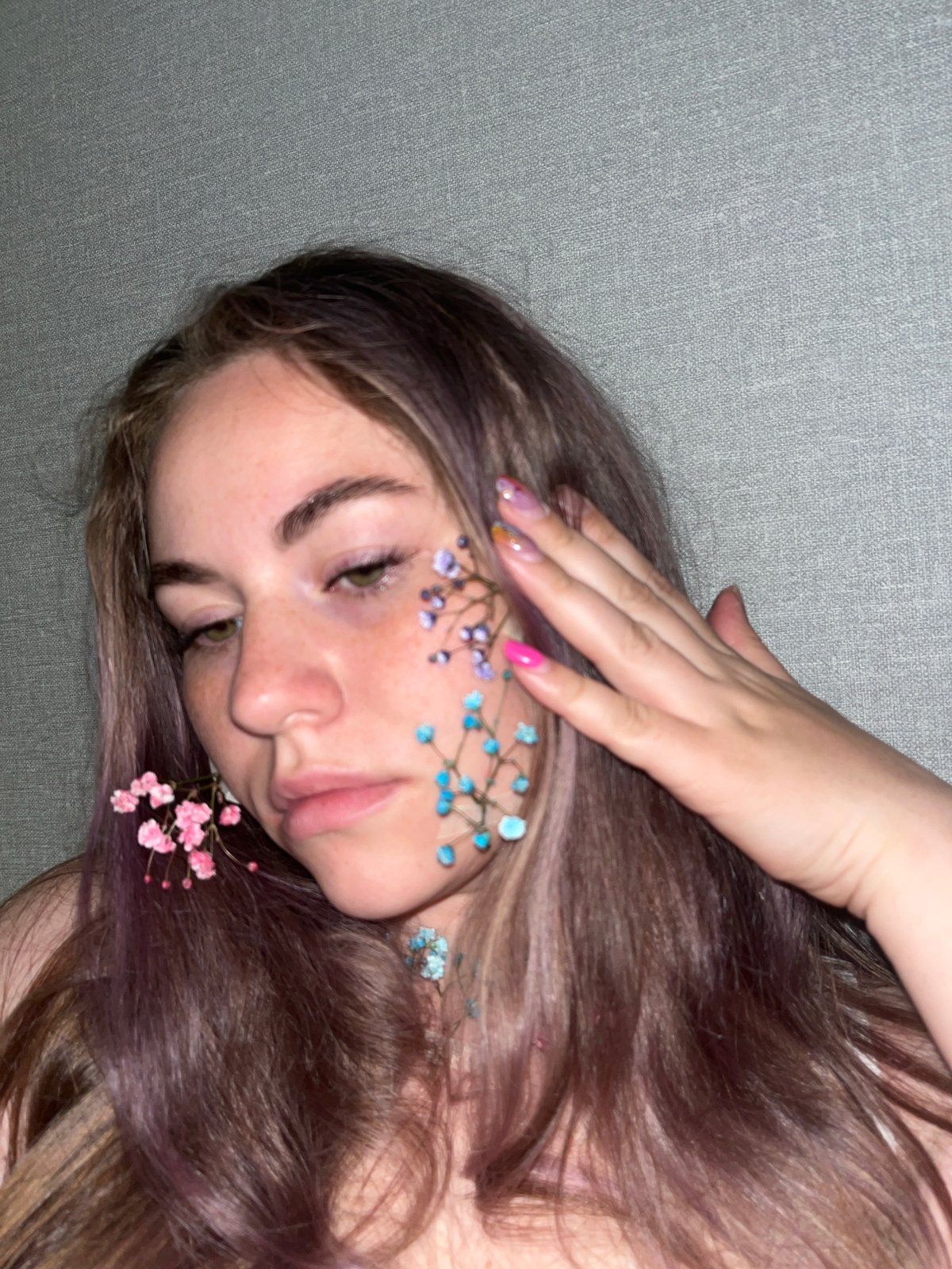 Woman poses with flowers in artistic photo session in Chaikovsky