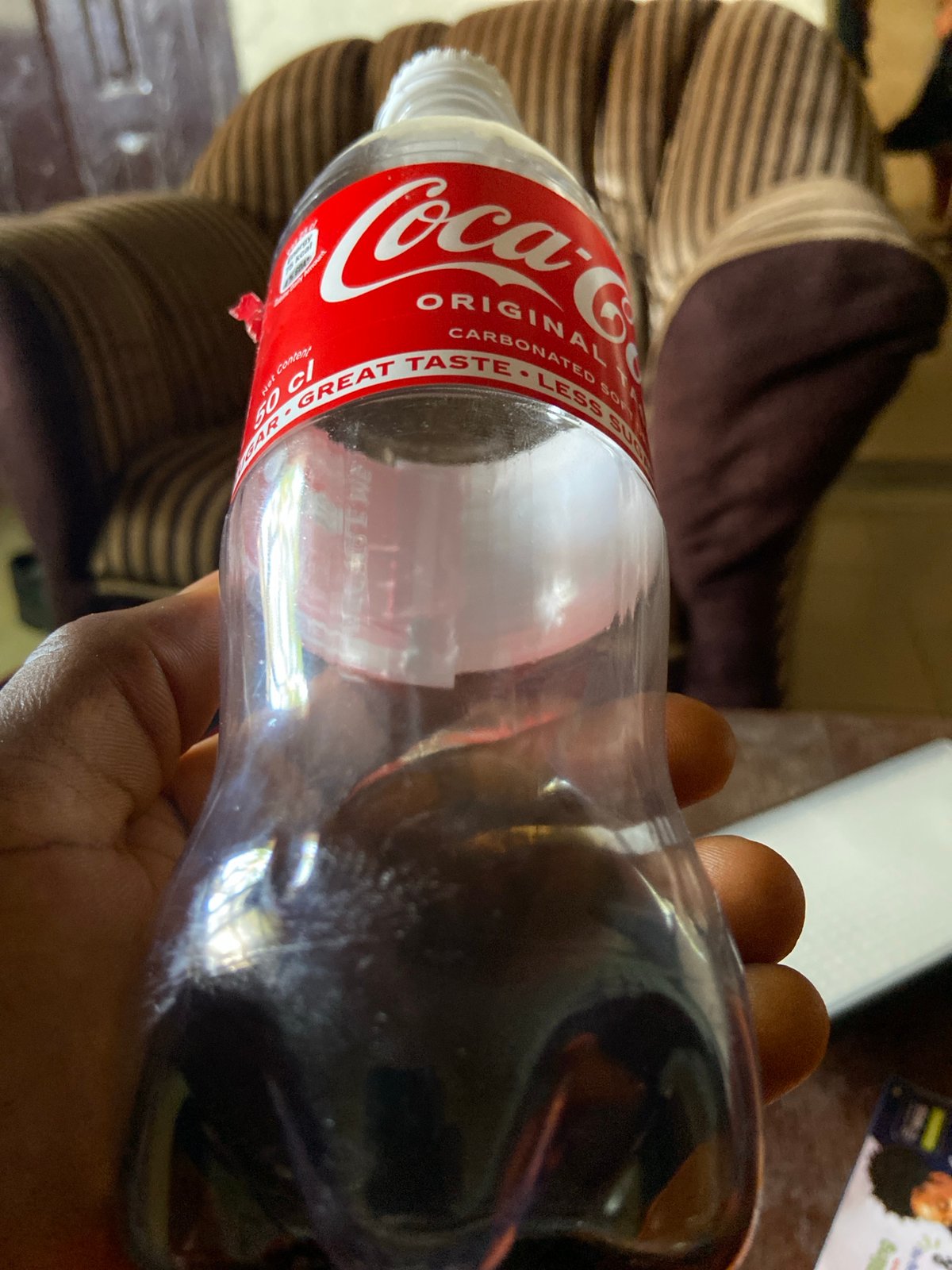 Children play soccer, drink Coke in Mararaba, Nigeria Sunday afternoon
