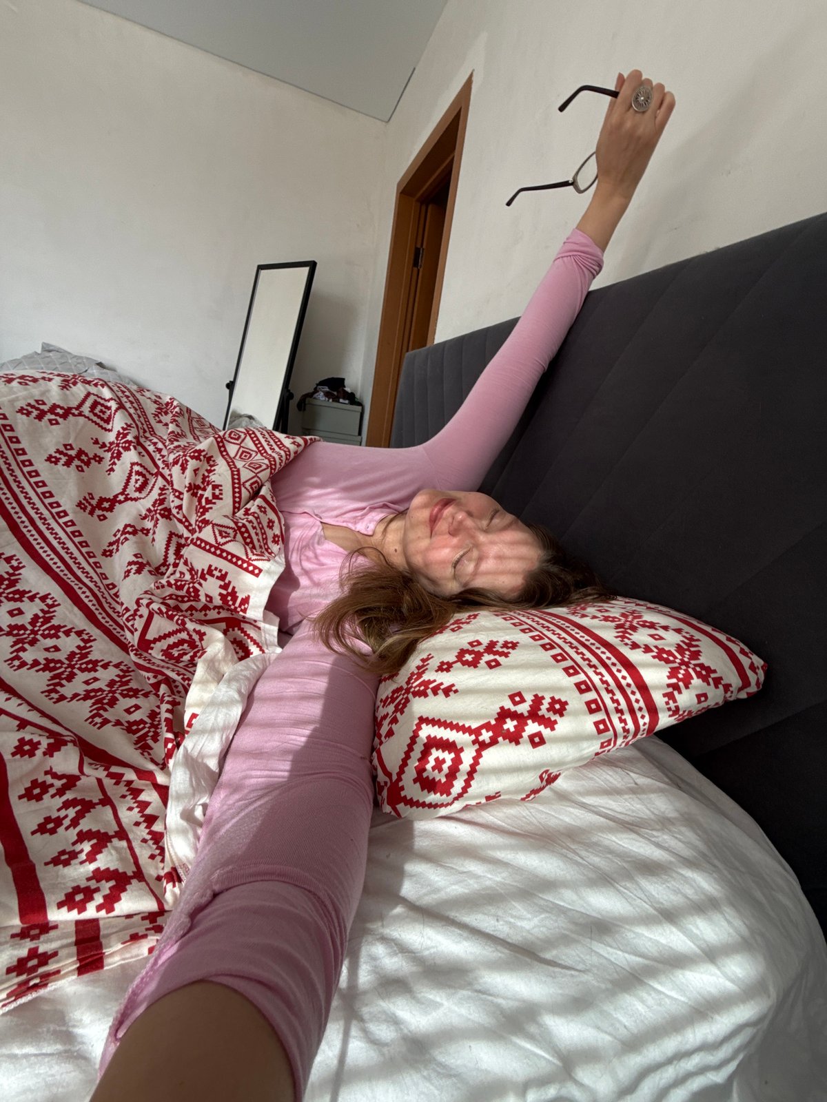 Woman and cat share quiet morning moments in Izhevsk