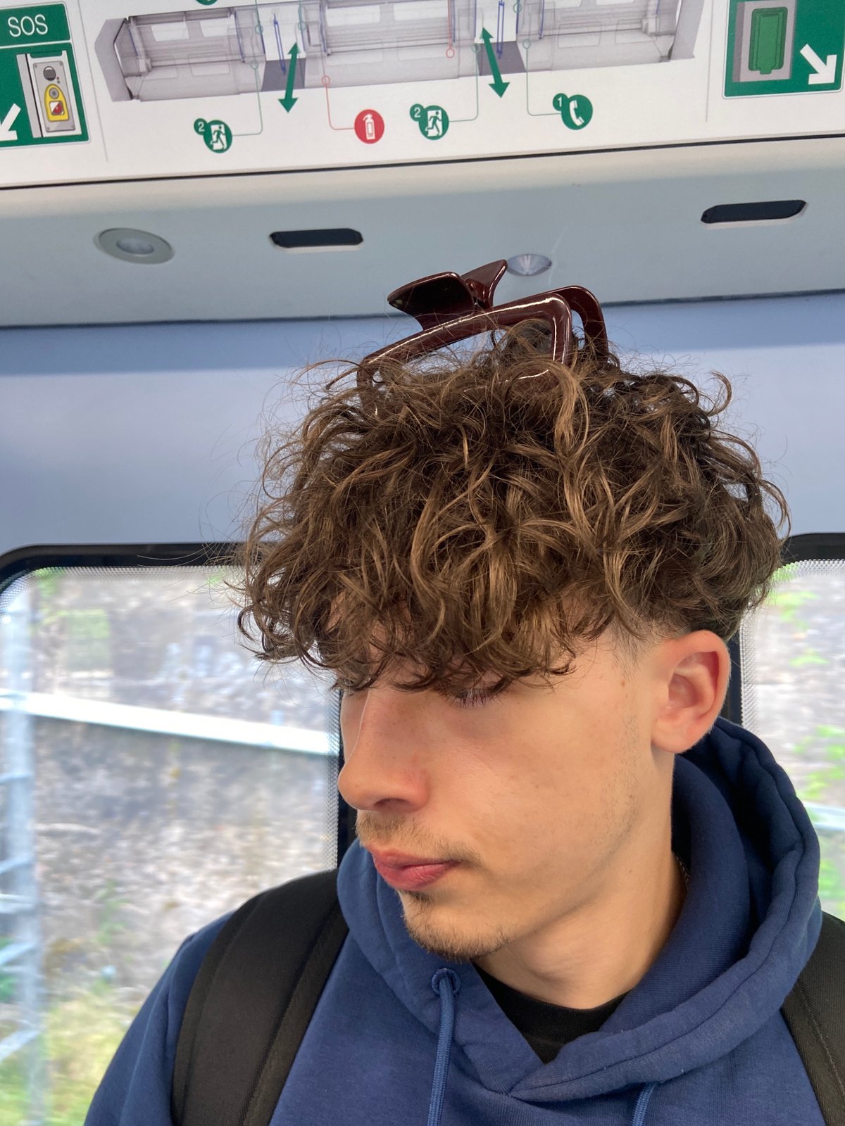 Commuter in blue hoodie observed on London public transport