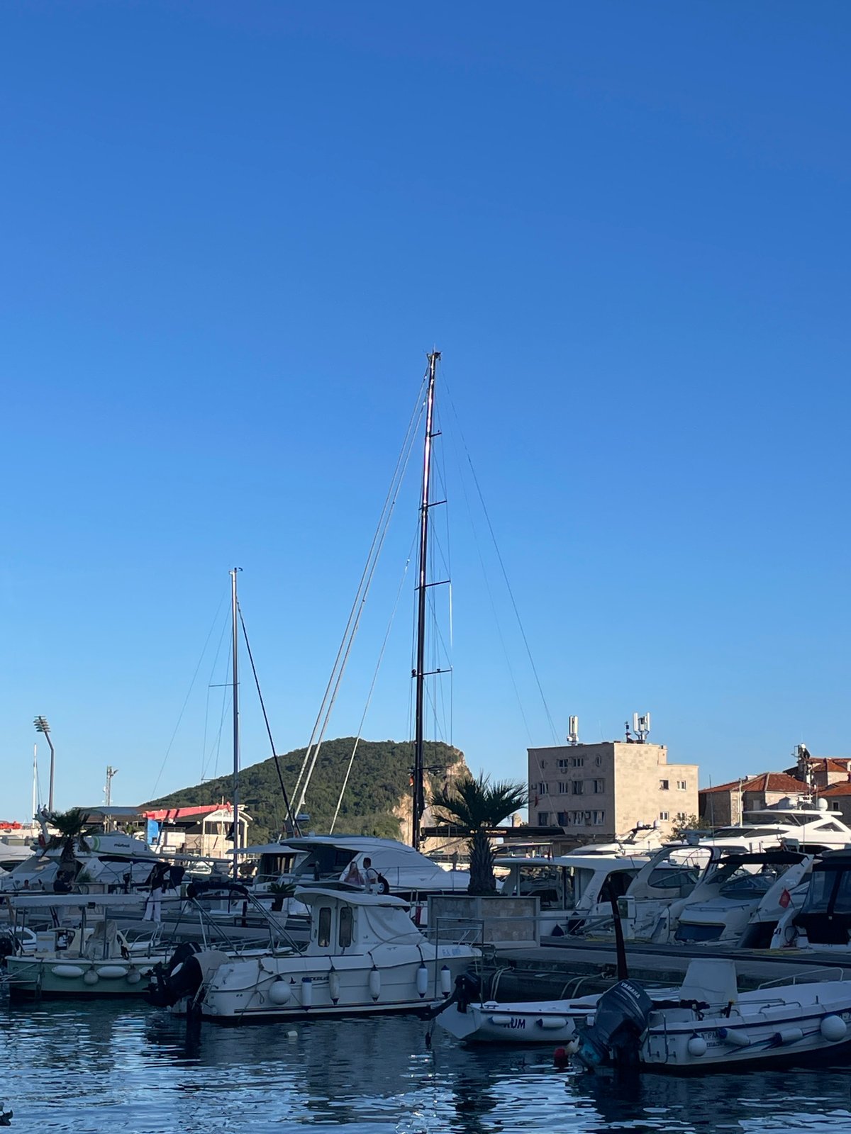 Tourist moments captured around Budva Marina on sunny afternoon