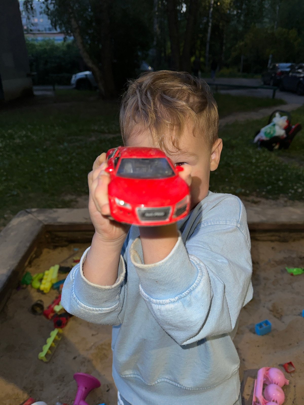 Sandbox playtime in a Nizhny Novgorod courtyard at dusk