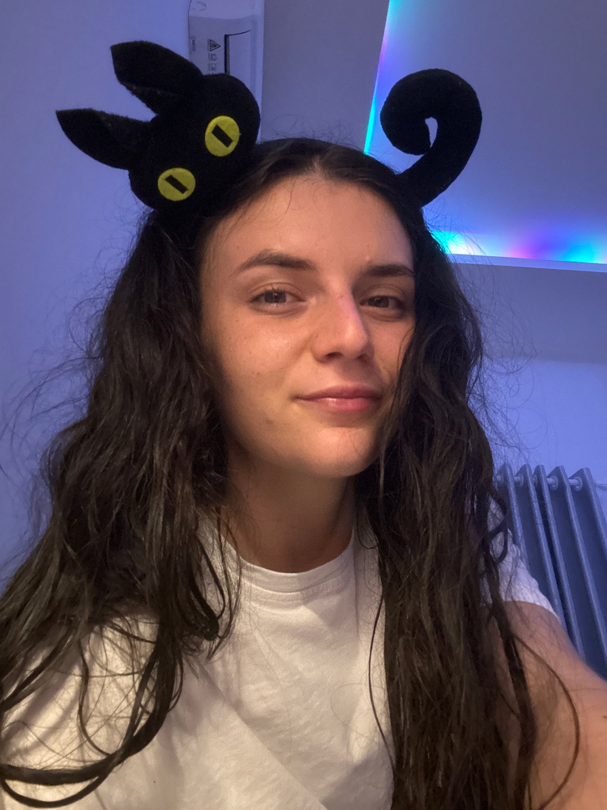 Woman in cat ears poses, sings in Mũi Né room