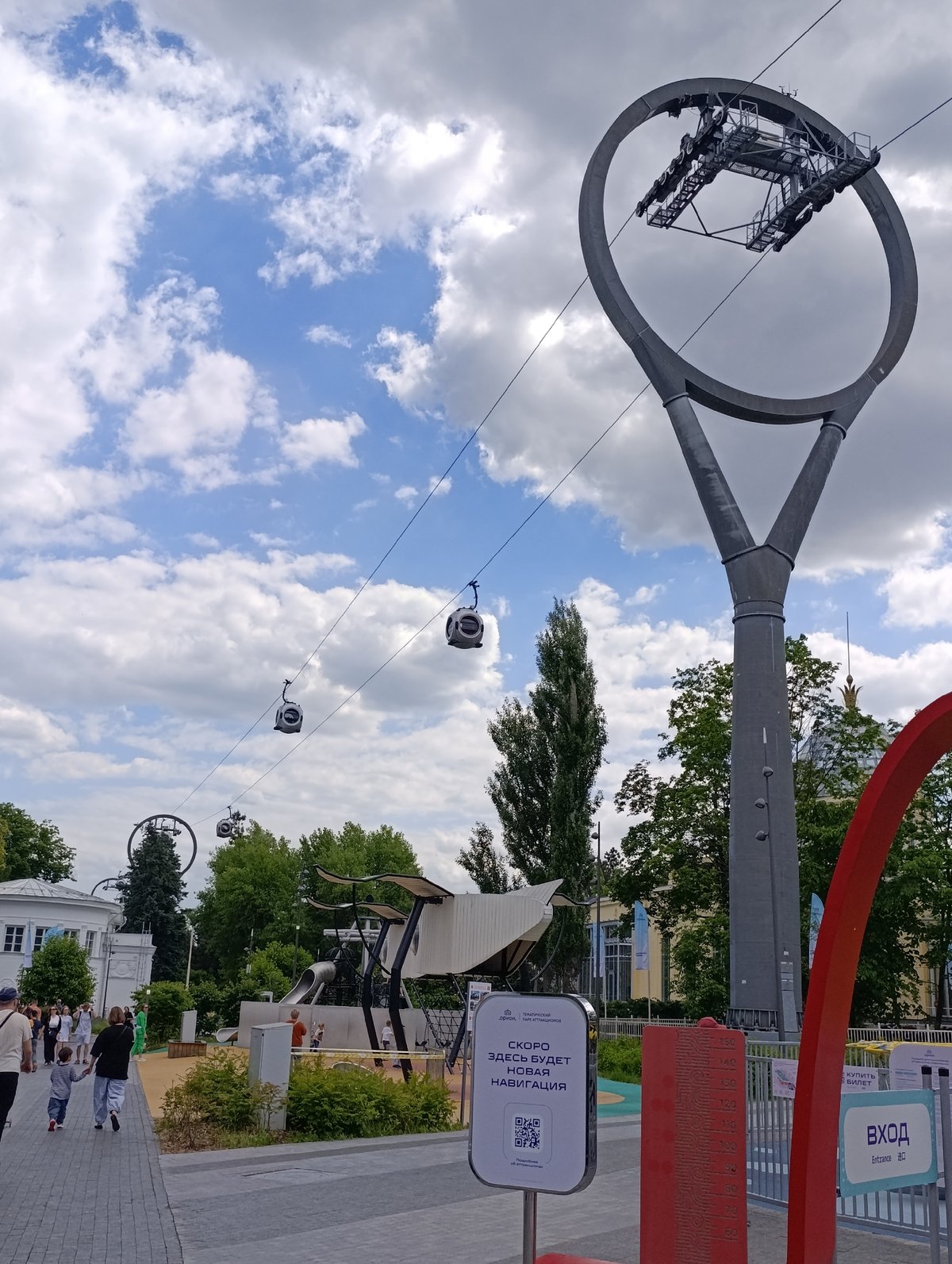 Visitors explore VDNKh attractions on sunny Moscow morning