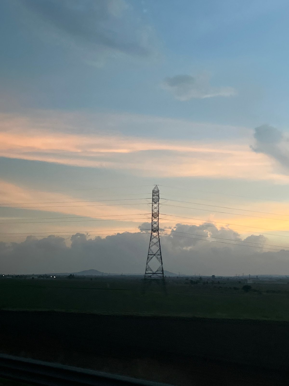 Transmission tower observed in agricultural field near Calpulalpan, Mexico
