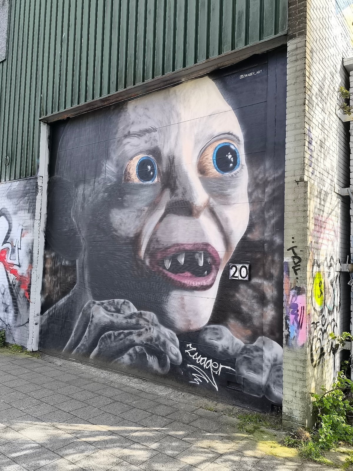 Street art murals featuring fantasy creature, heron documented in Alkmaar