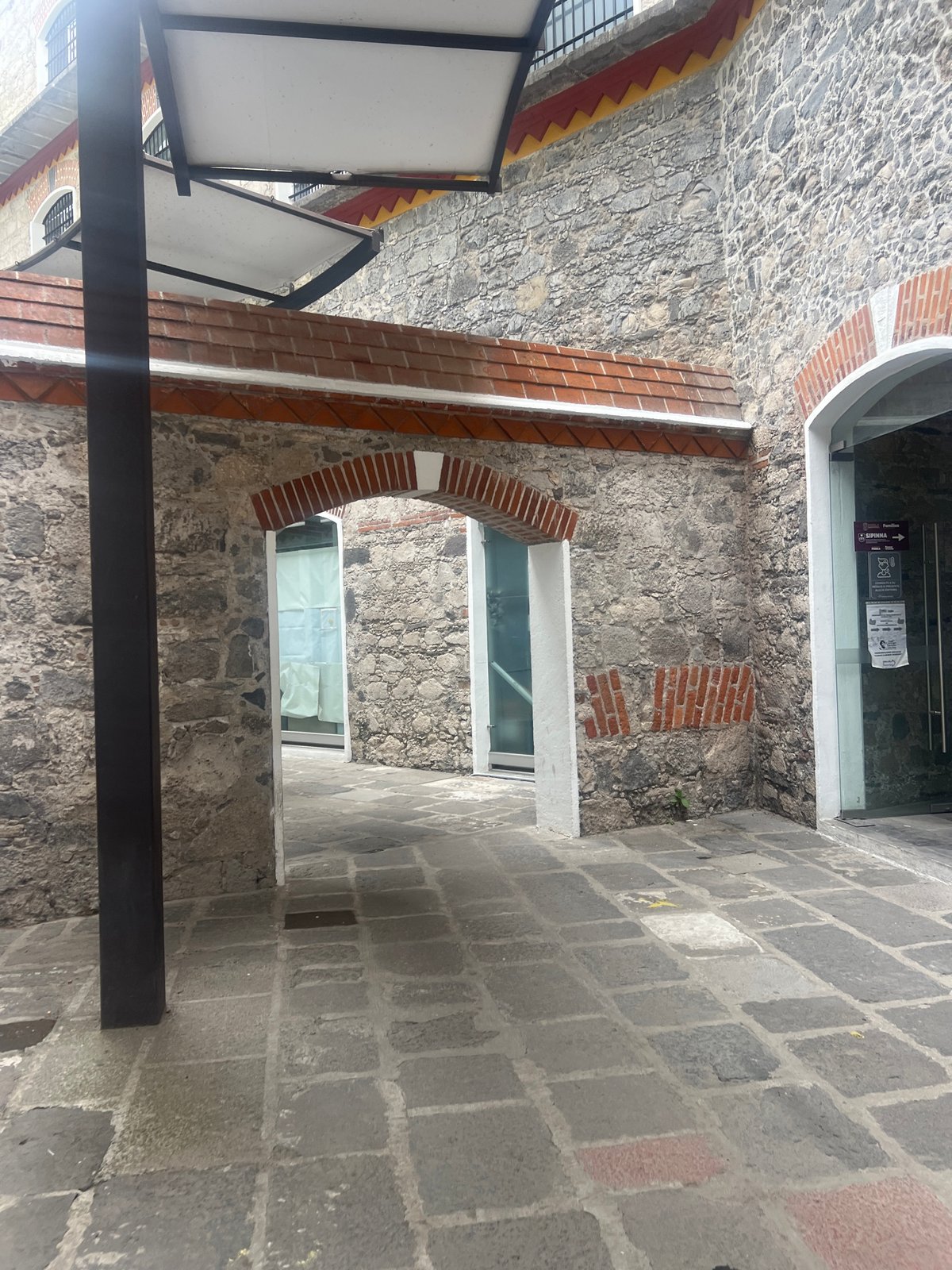 Stone passageway with brick arches documented in Puebla