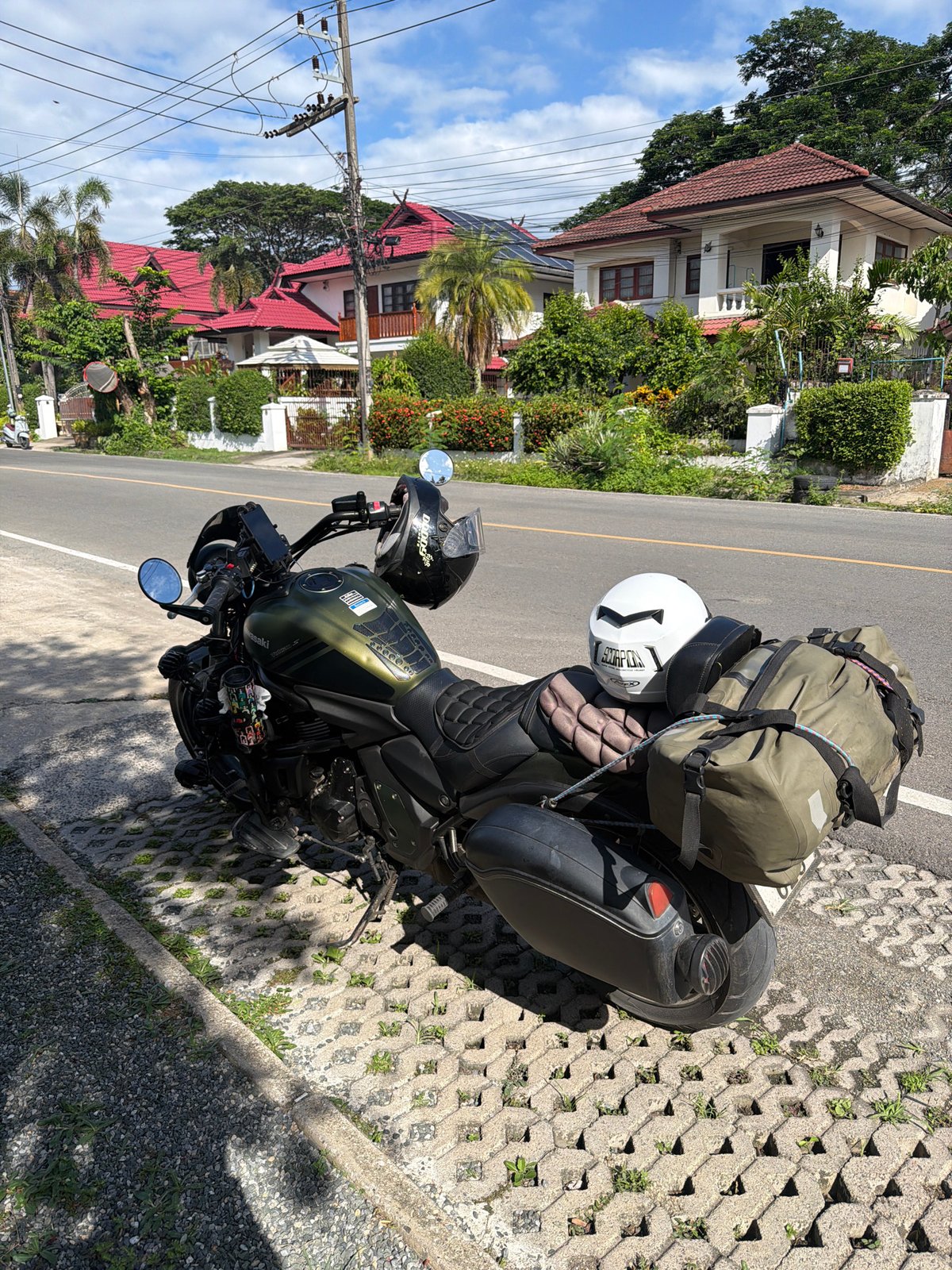 Morning cafe stop in Chang Phueak with a loaded touring motorcycle outside