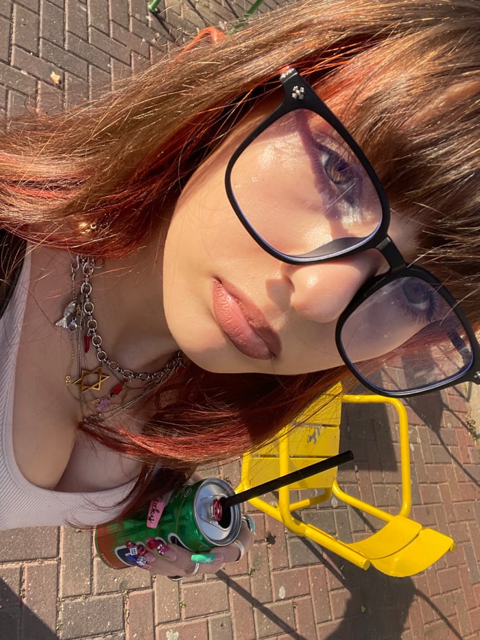 Woman documents afternoon in Ra'anana through selfies and cityscape views