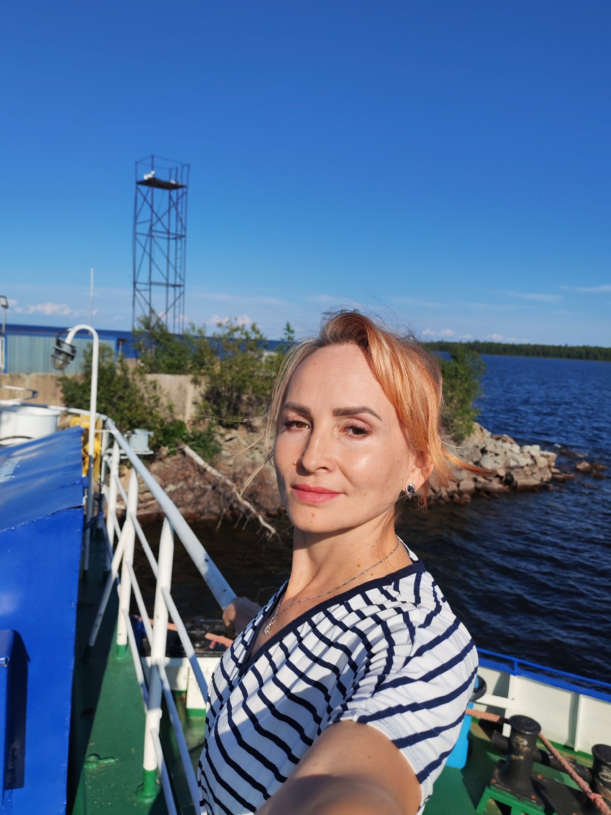 Ferry deck selfies and sunny waterway views in rural Russia