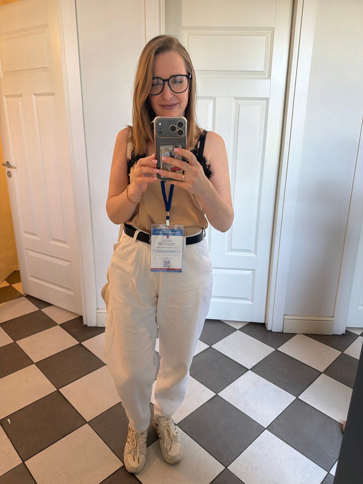 Woman documents Moscow park visit with selfies, tiled walkways
