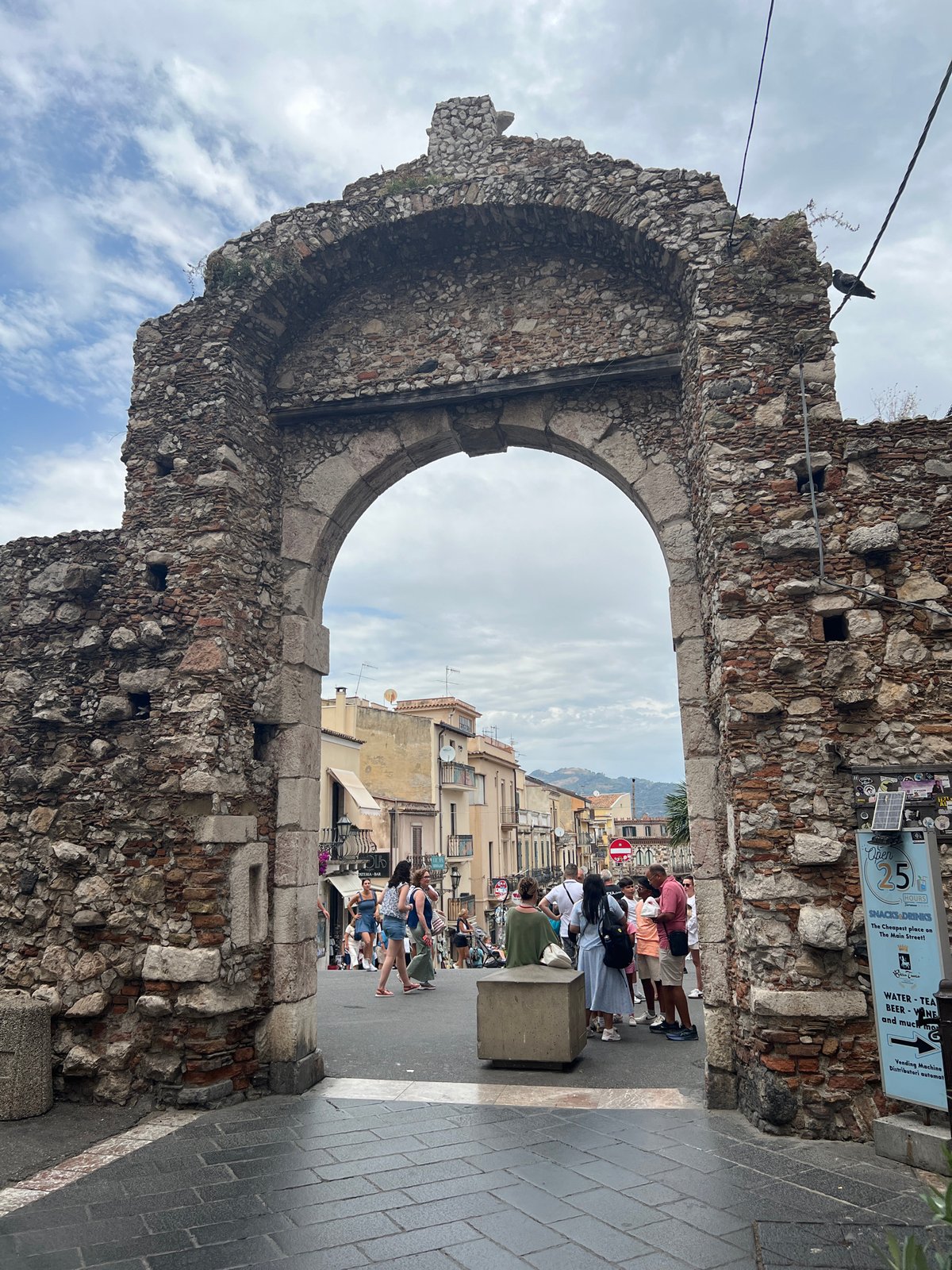 Morning stroll through Taormina's streets, archways, and hillside views